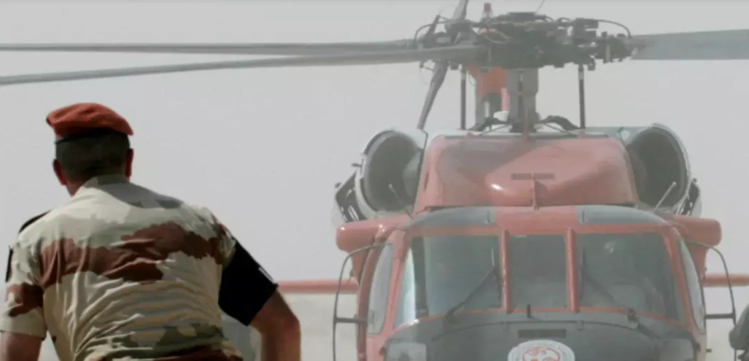 File photo: Multinational Force and Observers (MFO) helicopter and personnel work at the site of the French military transport aircraft crash at the village of Biat Jered in the Sinai region, May 7, 2007. Khaled Desouki / AFP