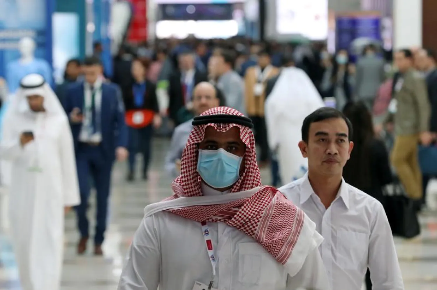 A vistor wears a mask during the Arab Health Exhibition in Dubai, United Arab Emirates January 29, 2020. REUTERS/Christopher Pike
