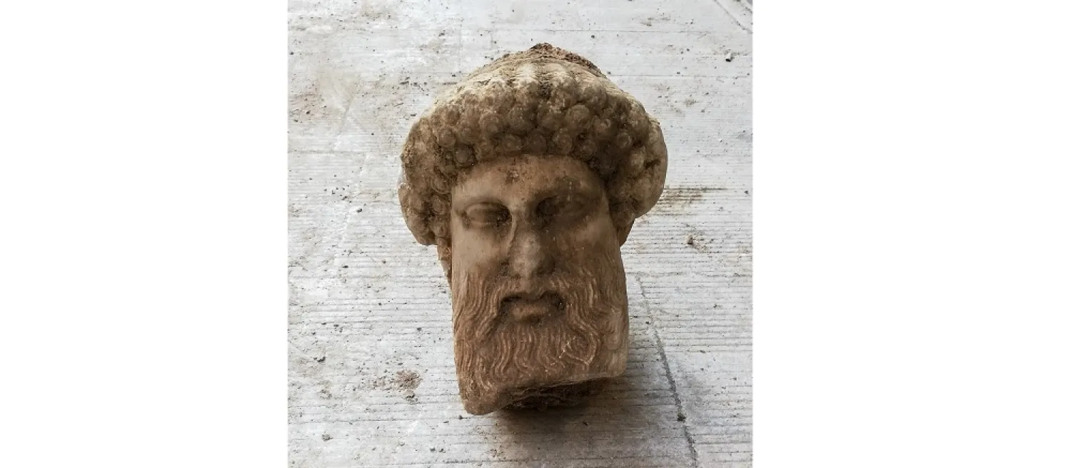 In this undated photo, provided by the Greek Culture Ministry on Nov. 15, 2020, a head of the ancient god Hermes is pictured after being found during sewage works in Athens. (AP)