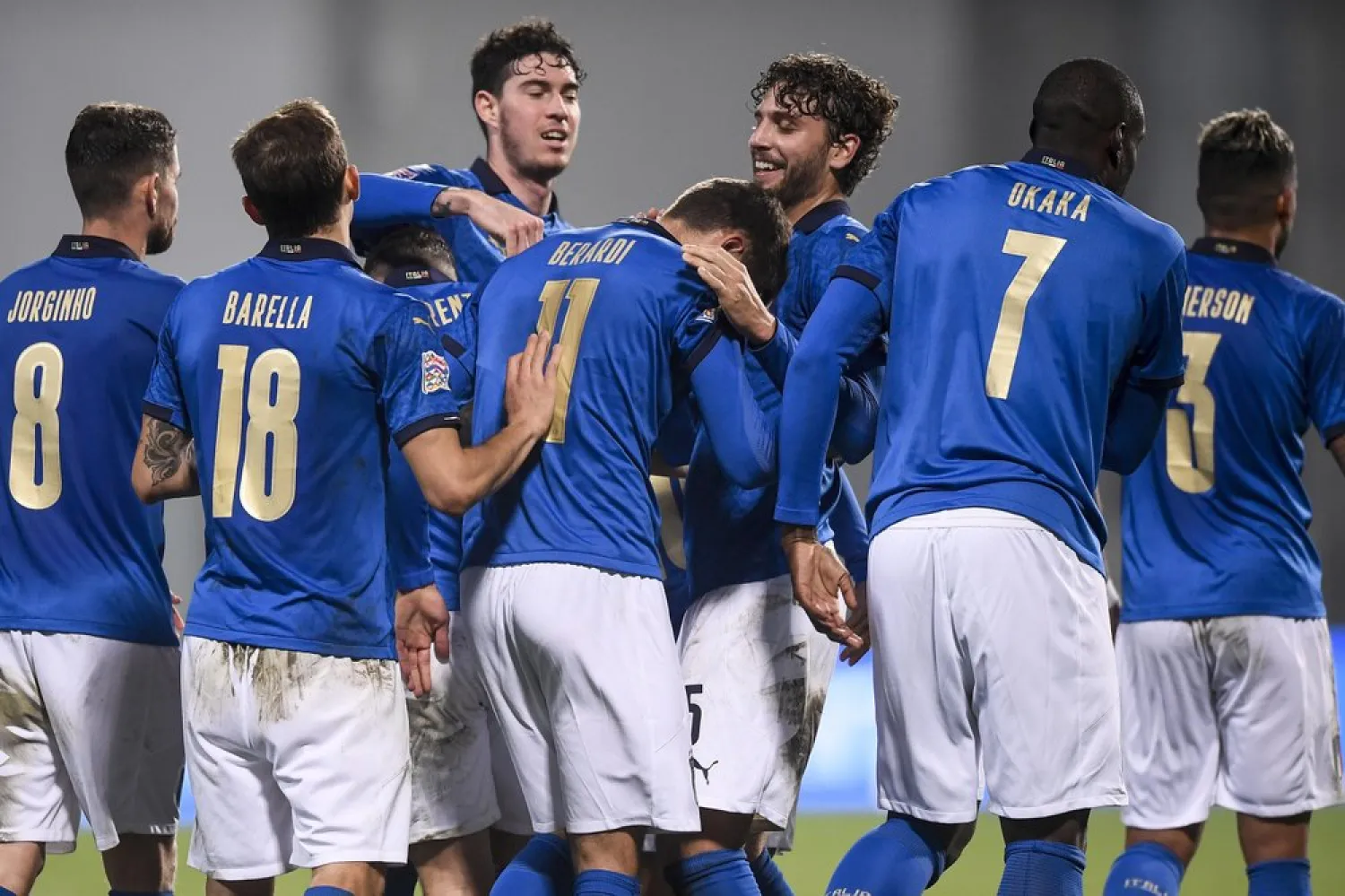 Italy's players celebrate after Domenico Berardi, center (11) scored the winning goal during the Nations League match against Poland at Mapei Stadium, in Reggio Emilia, Italy, Nov. 15, 2020. (AP)