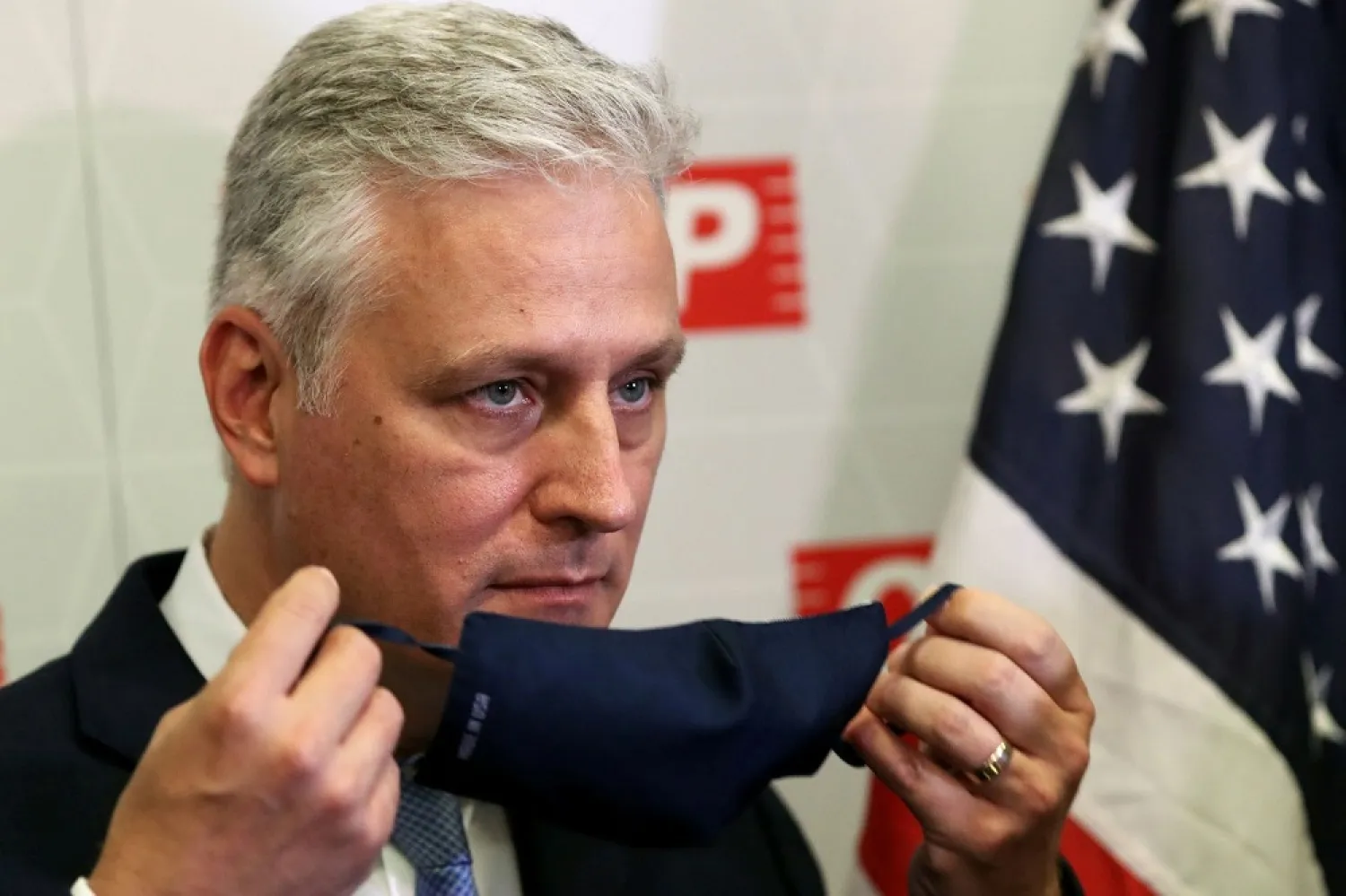 US national security adviser Robert O'Brien takes off his face mask during a meeting at Sao Paulo's Industries Federation President in Sao Paulo, Brazil October 19, 2020. (Reuters)