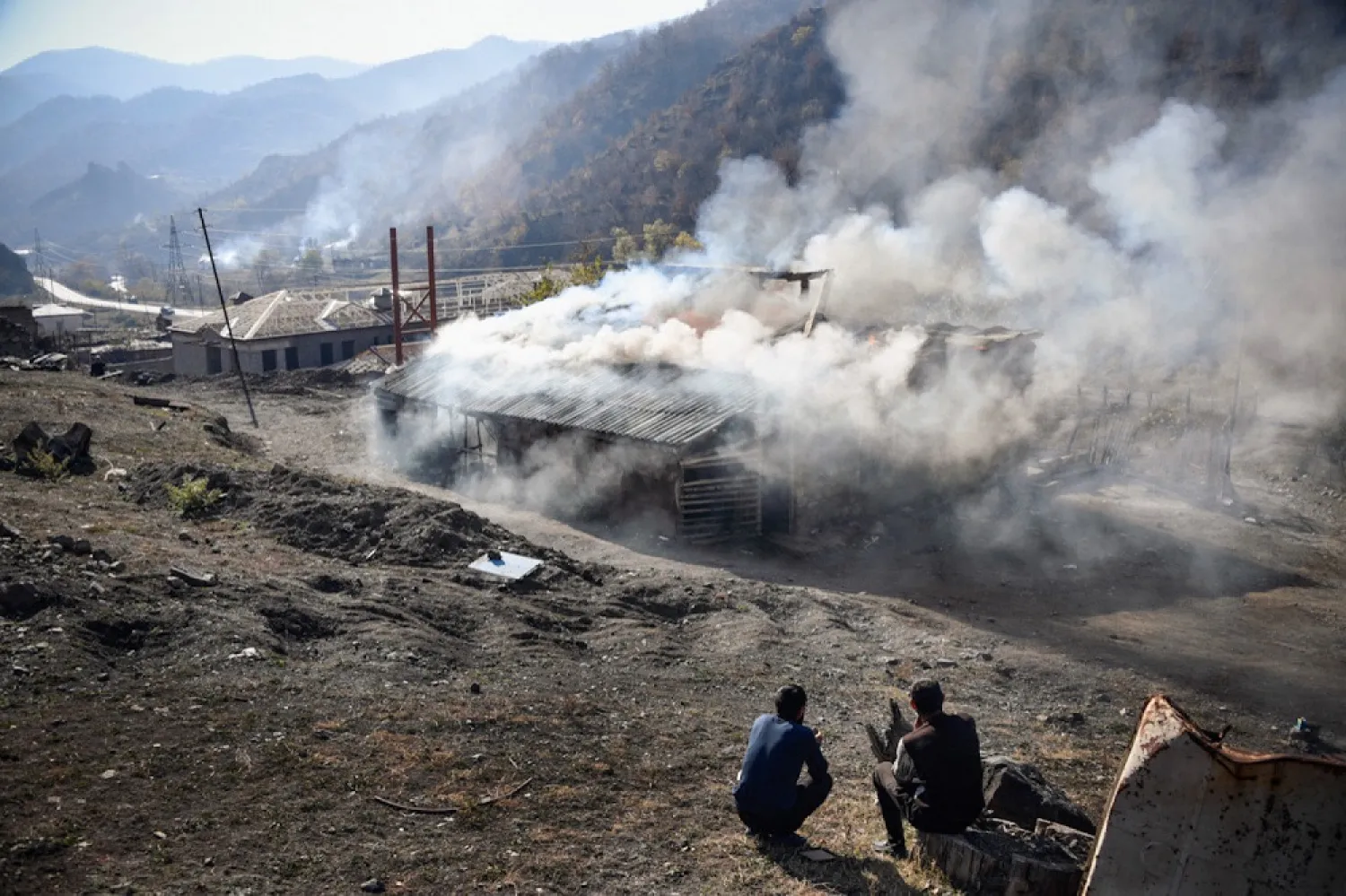 Armenians living in the Kalbajar district, which had been controlled by Armenian forces since the 1990s Nagorno-Karabakh war, set fire to their homes rather than hand them over to Azerbaijan. (AFP)