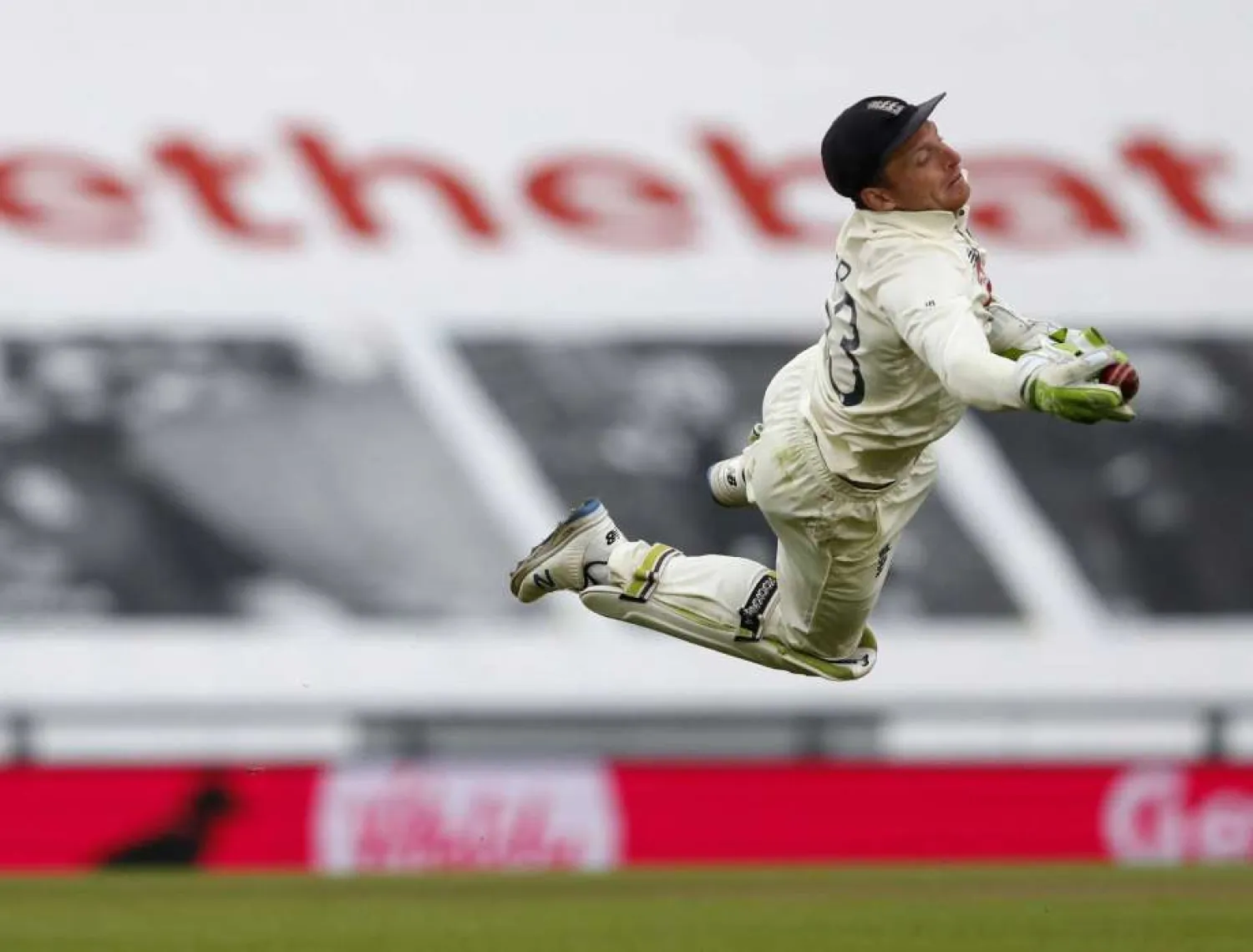 In this file photo dated Sunday, Aug. 23, 2020, England's wicketkeeper Jos Buttler dives to take the catch to dismiss Pakistan's Shaheen Afridi during the third cricket Test match between England and Pakistan, at the Ageas Bowl in Southampton, England. England's cricketers are flying to South Africa it is announced Monday Nov. 16, 2020, on the back of reassurances from team management that the white-ball tour will take place as scheduled, although England star Jos Buttler said CSA's issues had led to him fearing the tour might be canceled. (AP Photo/Alastair Grant, FILE)