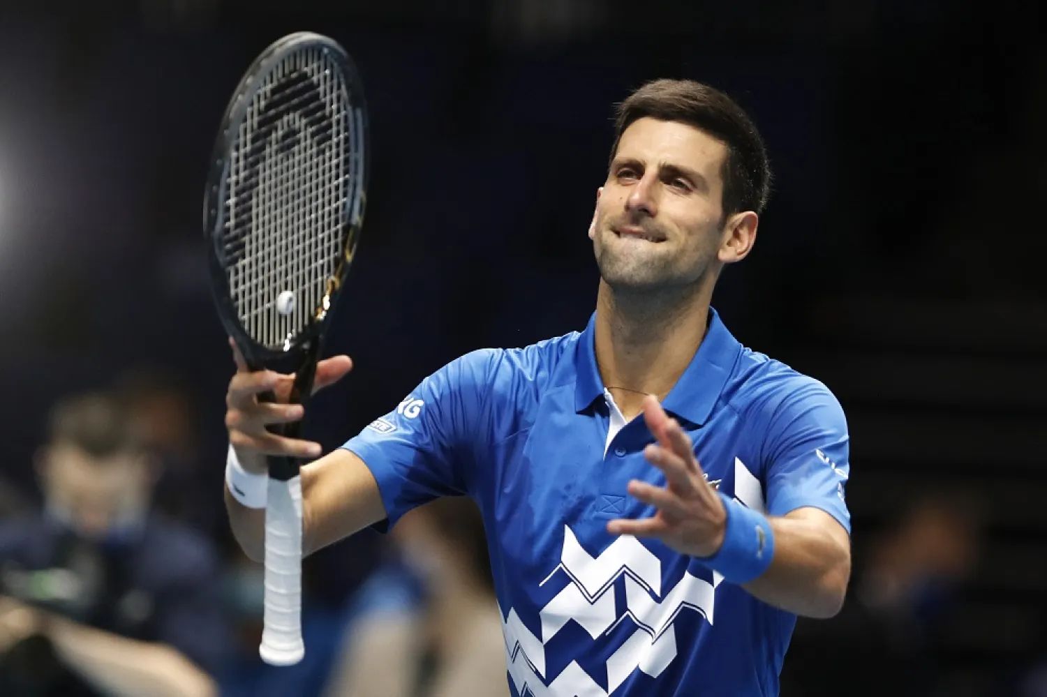 Novak Djokovic celebrates winning match point against Alexander Zverev during their match at the ATP World Finals tennis tournament at the O2 arena in London, Nov. 20, 2020. (AP)