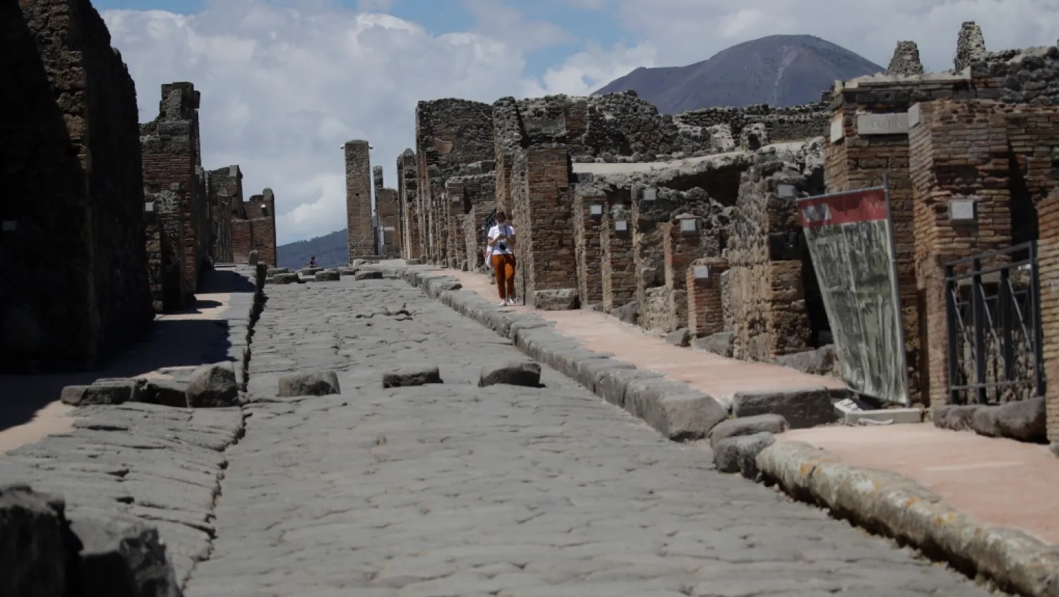 A woman visits the archeological site of Pompeii, Italy, as the site reopened to the public after a two-month lockdown due to the COVID-19 pandemic, May 26, 2020. (AP Photo/Alessandra Tarantino)