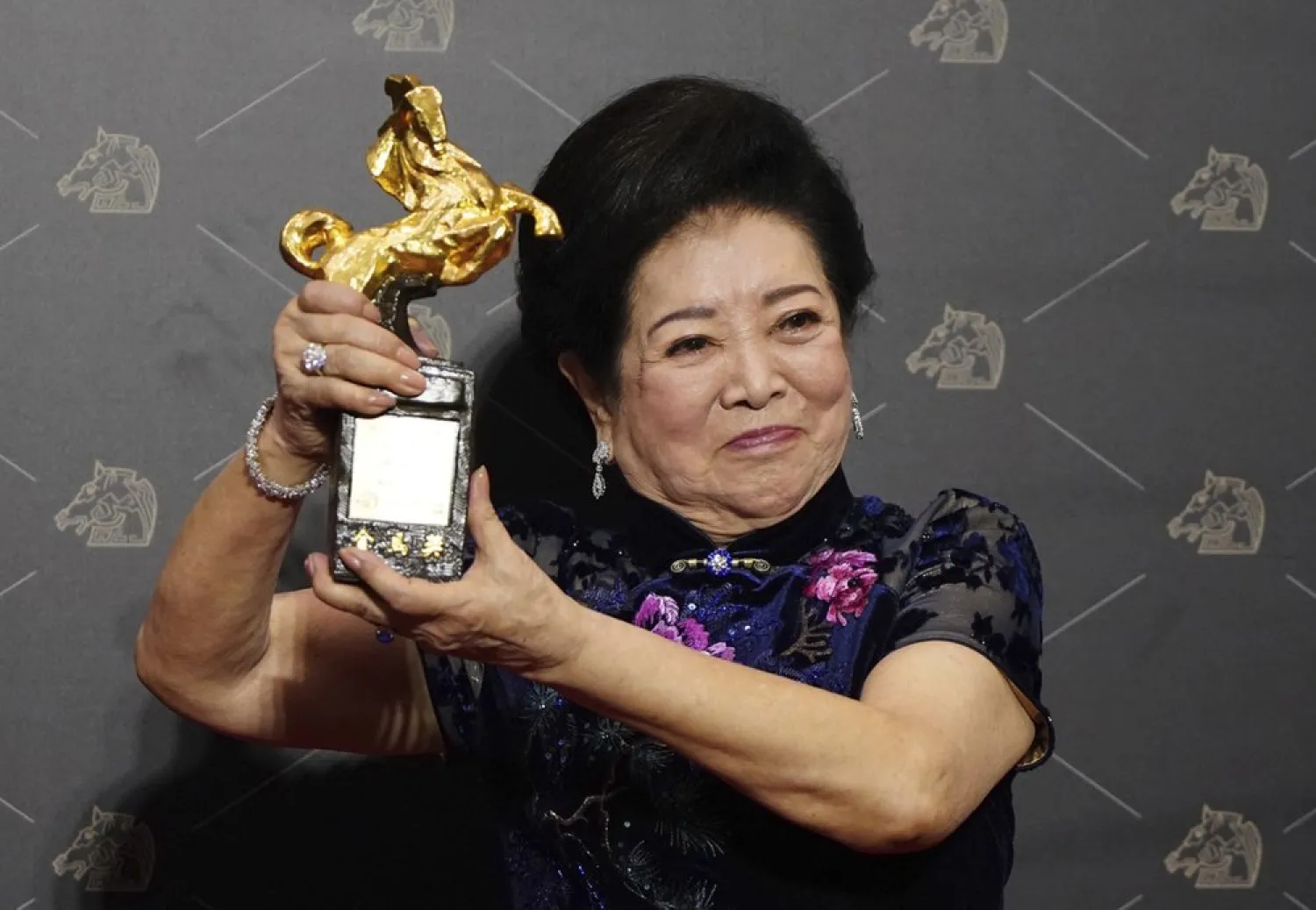 Taiwanese actress Chen Shu-fang holds her award for Best Supporting Actress at the 57th Golden Horse Awards in Taipei, Taiwan, Saturday, Nov. 21, 2020. (AP)