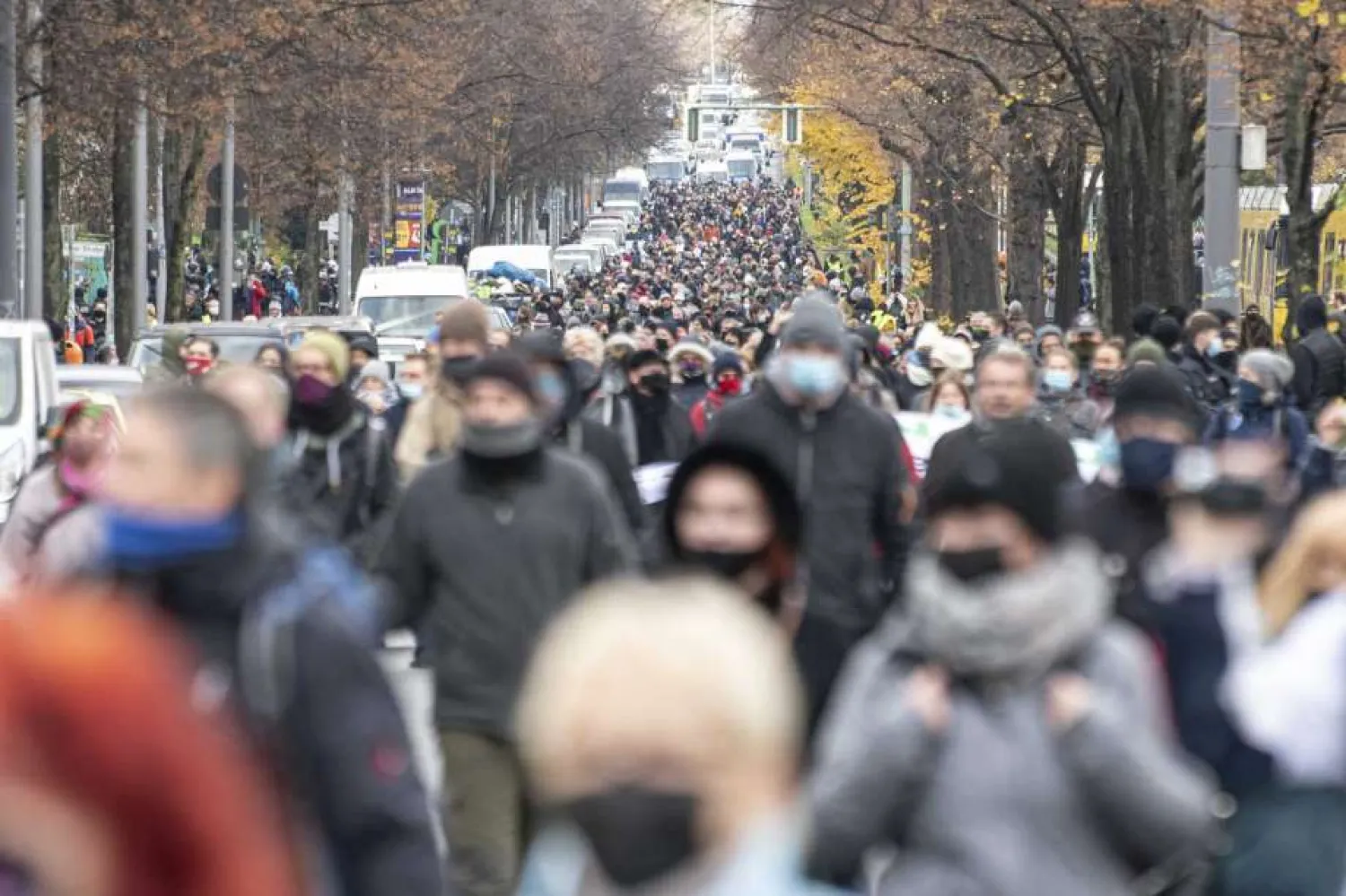 Protestors attend a so-called 'silent march' against the corona policy of the federal government at the district Prenzlauer Berg in Berlin Germany, Sunday, Nov. 22, 2020. (Fabian Sommer/dpa via AP)