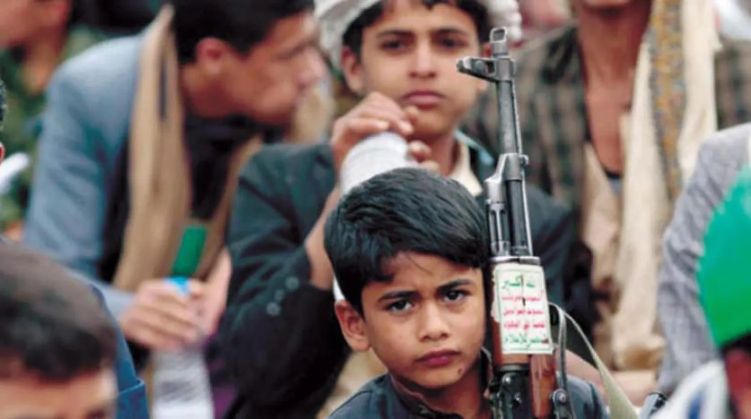A Yemeni child carrying a weapon during a gathering in Sanaa (Getty Images)