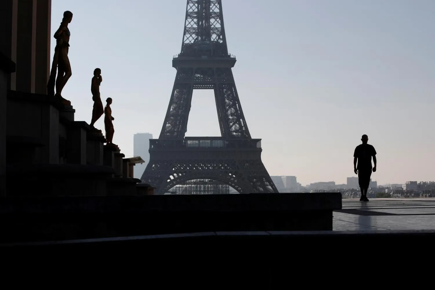 A person walks on Trocadero square as a lockdown is imposed to slow the rate of the coronavirus disease (COVID-19) in Paris, France, April 26, 2020. REUTERS/Gonzalo Fuentes
