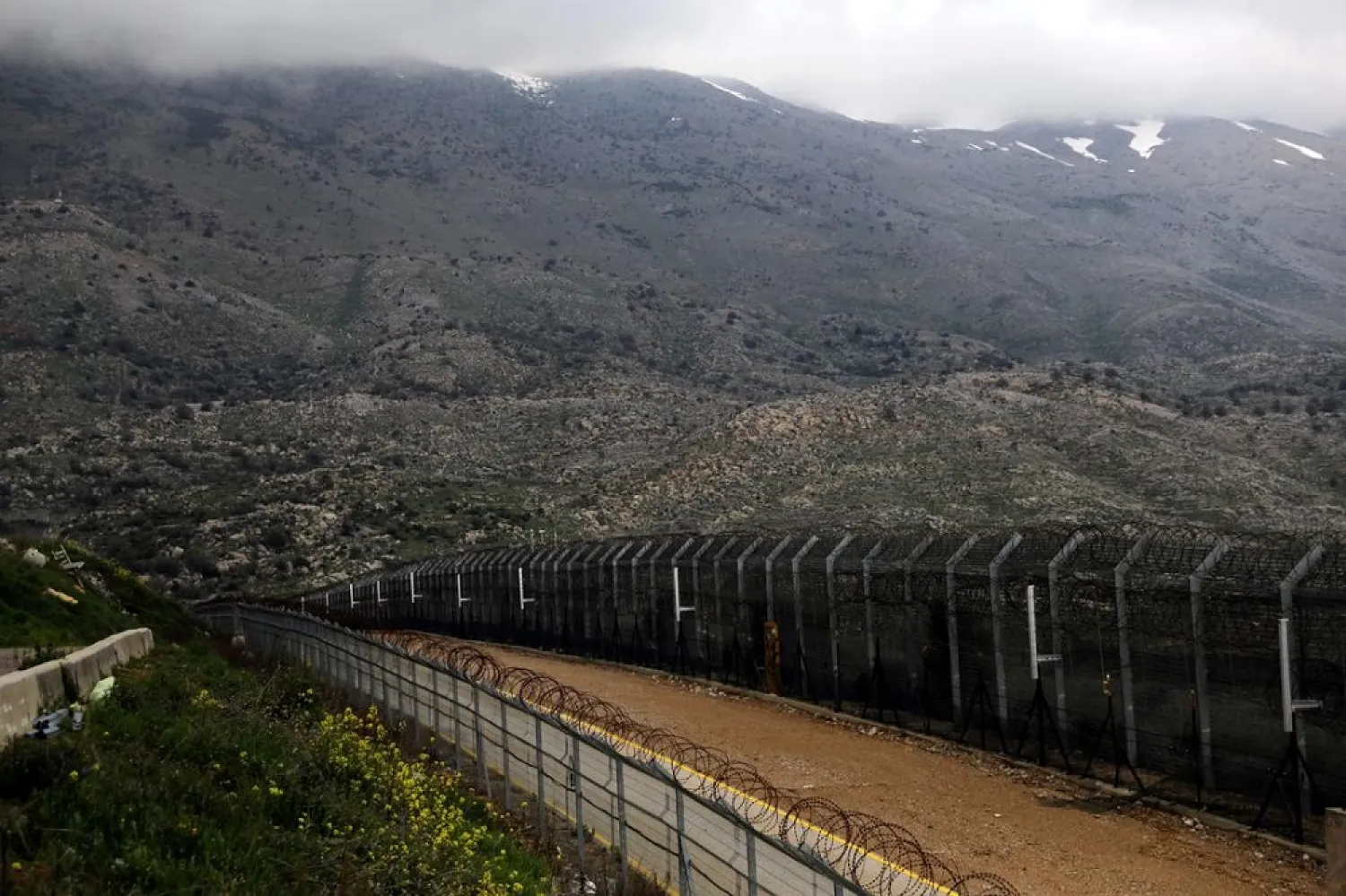 Fences are seen on the ceasefire line between Israel and Syria in the Israeli-occupied Golan Heights, March 25, 2019. (Reuters)