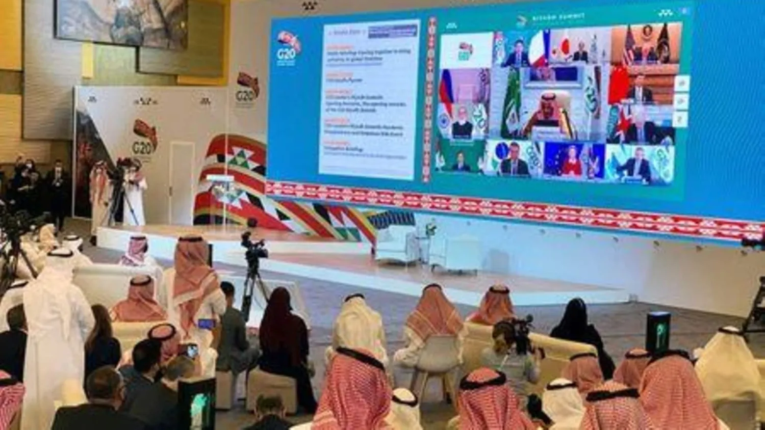 Media watches Saudi King Salman bin Abdulaziz's virtual speech live at the media center during an opening session of the 15th annual G20 Leaders' Summit in Riyadh, Saudi Arabia November 21, 2020. REUTERS/Nael Shyoukhi