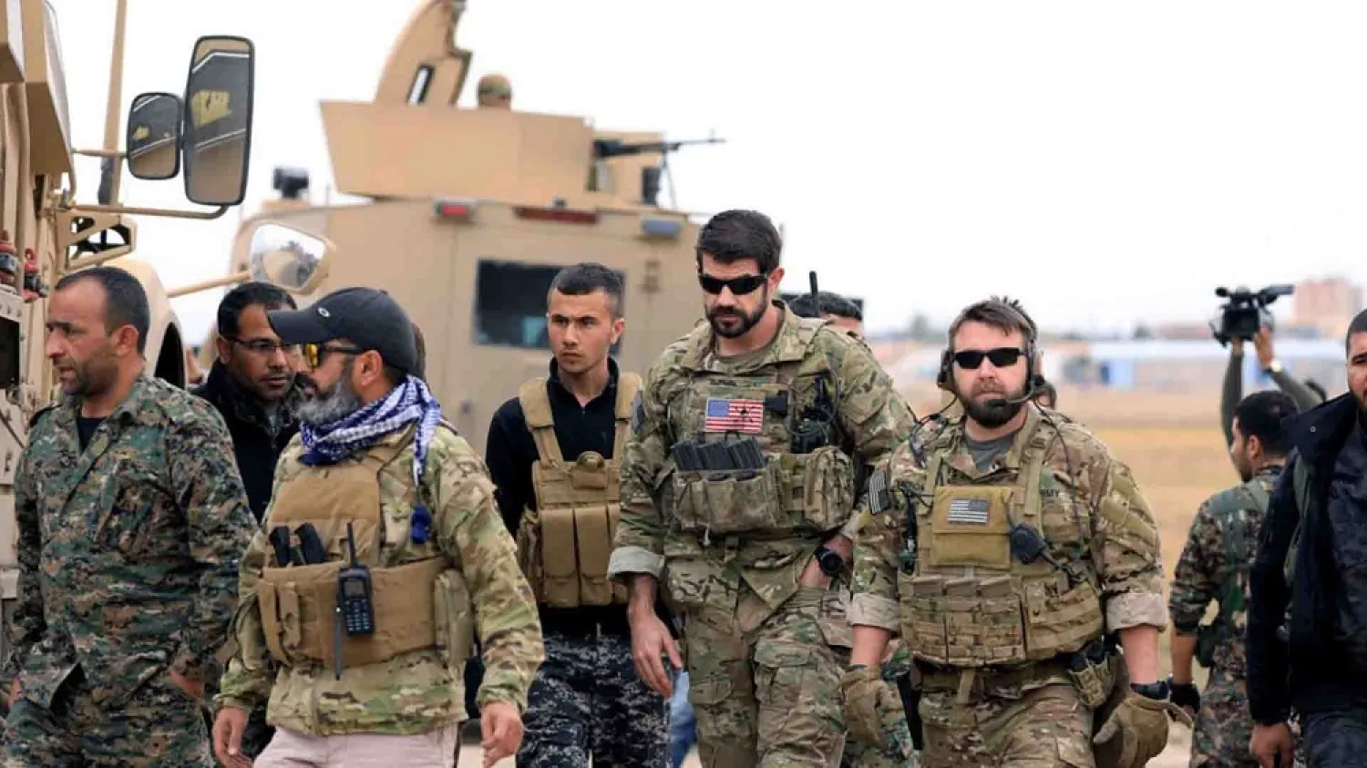 Syrian Democratic Forces and US troops are seen during a patrol near the Turkish border in Hasakeh, Syria. (Reuters file photo)