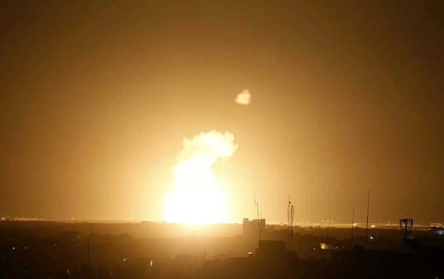 Flames are seen following an Israeli air strike in the town of Khan Yunis, in the southern Gaza Strip, early on November 22, 2020. AFP