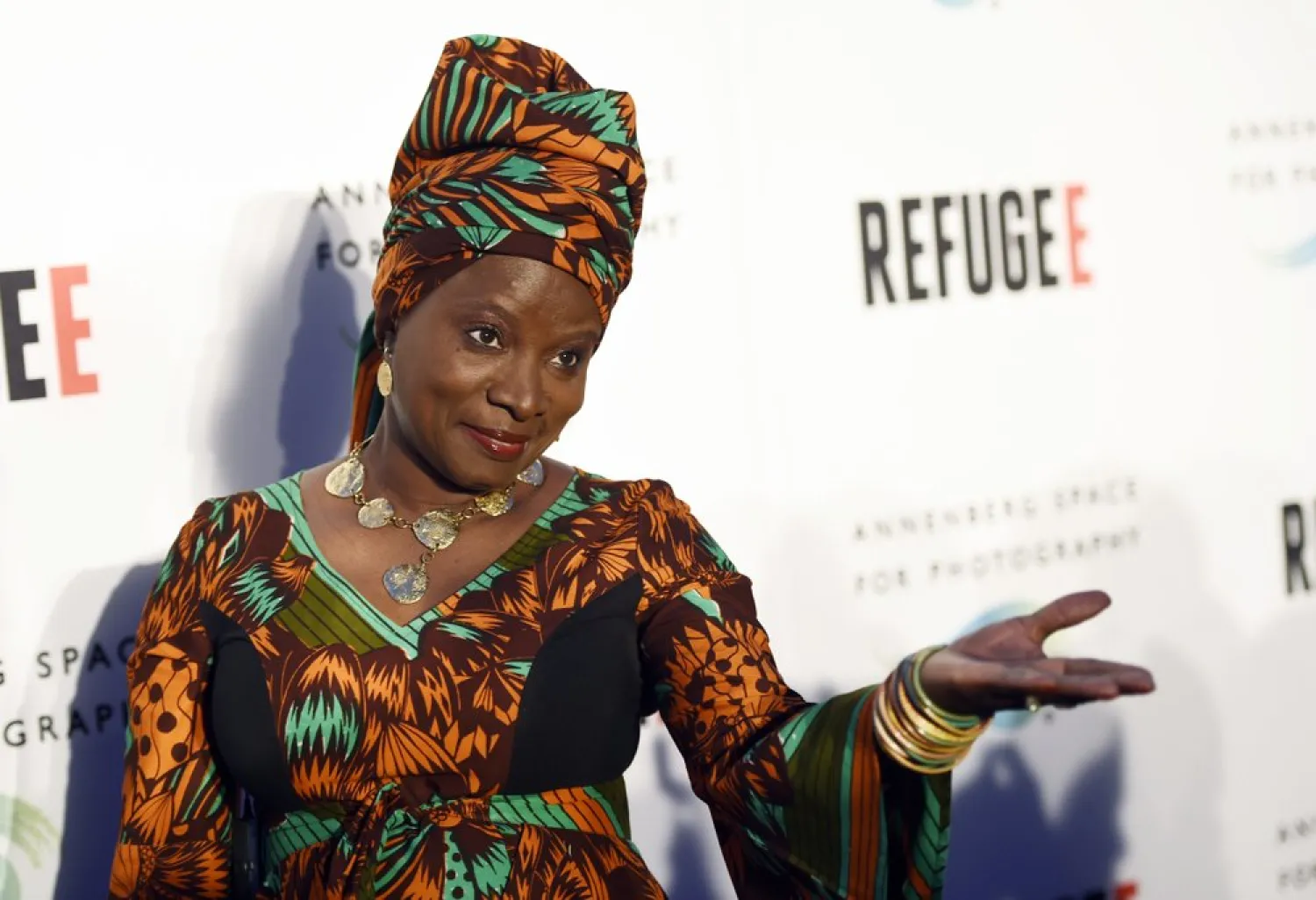 FILE - In this Thursday, April 21, 2016, file photo, singer and UNICEF Goodwill Ambassador Angelique Kidjo poses at the opening of the new photography exhibit "REFUGEE" at The Annenberg Space for Photography in Los Angeles. (Photo by Chris Pizzello/Invision/AP, File)
