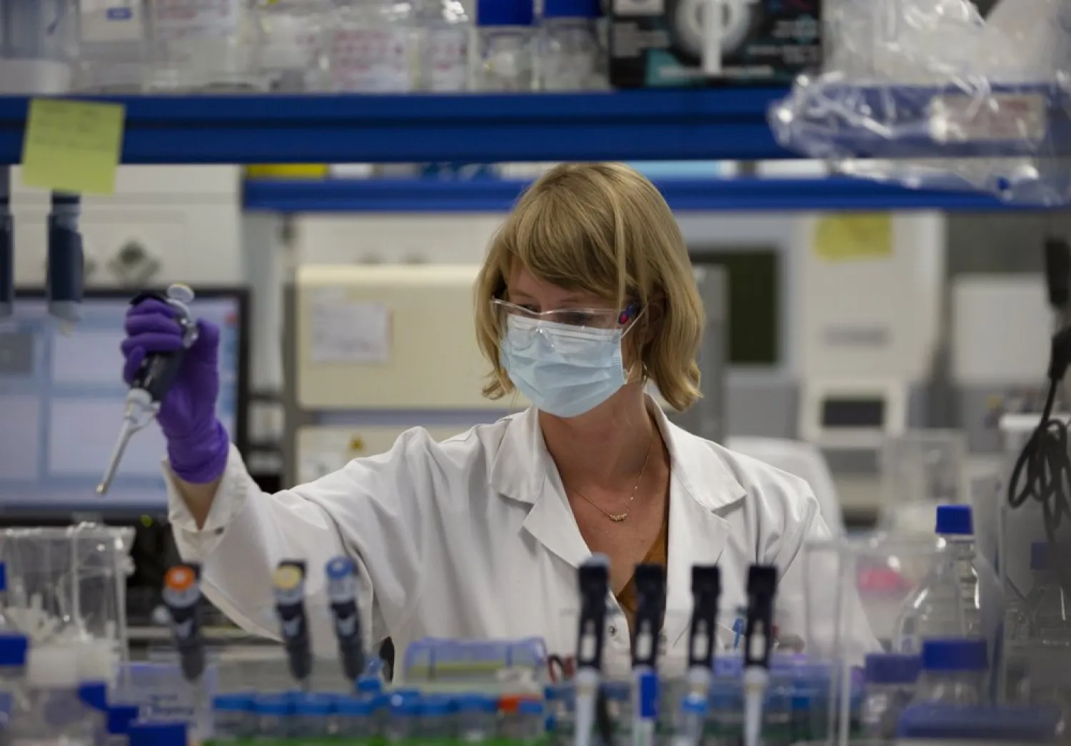 A lab technician works during research on coronavirus, COVID-19 (AP Photo/Virginia Mayo)
