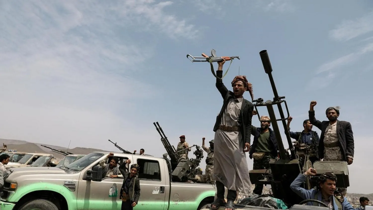 Houthi militants shout slogans during a gathering on the outskirts of Sanaa, Yemen. (Reuters)
