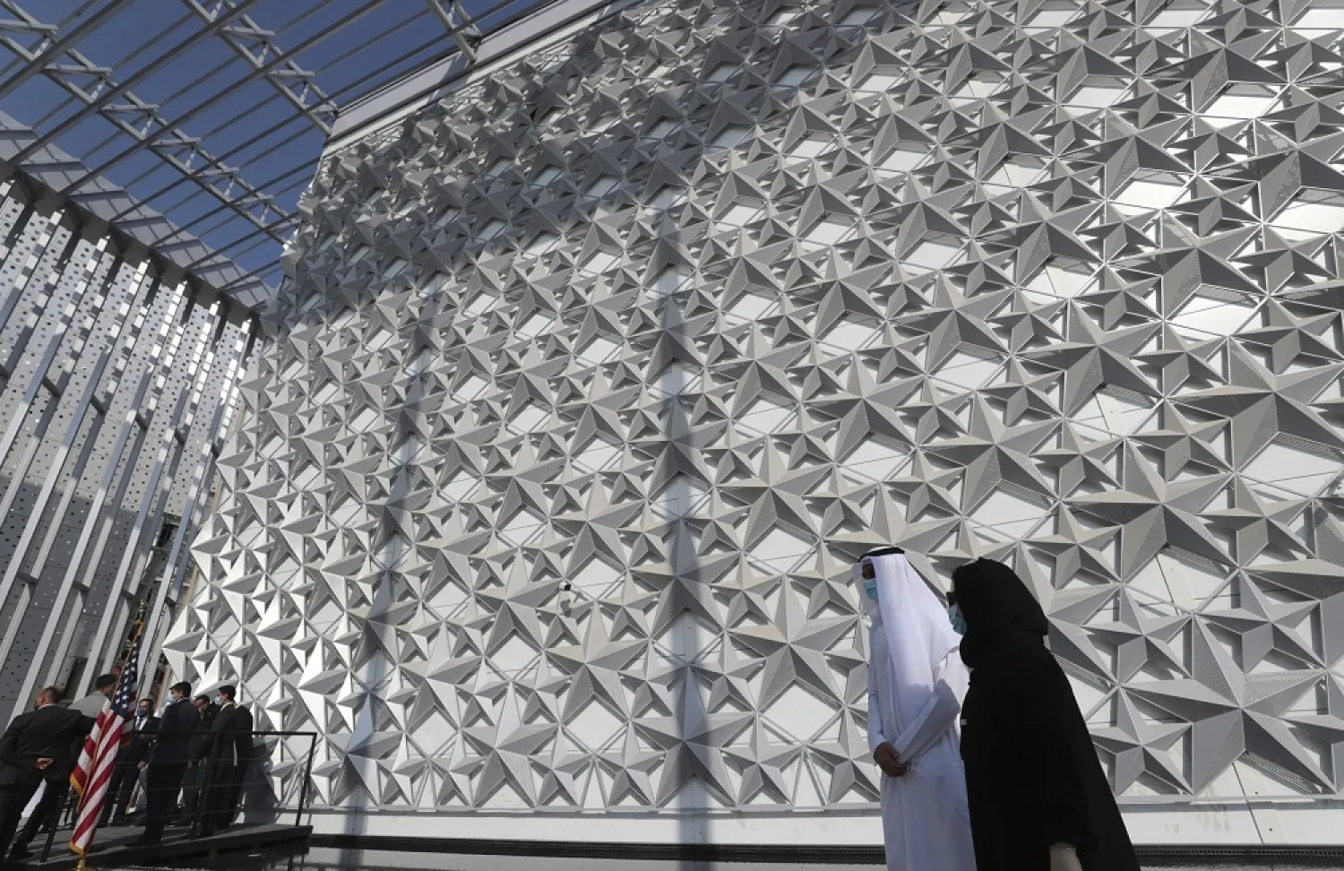 In this Nov. 18, 2020 file photo, people walk past the USA Pavilion at the site of Dubai Expo 2020, in Dubai, United Arab Emirates. (AP)