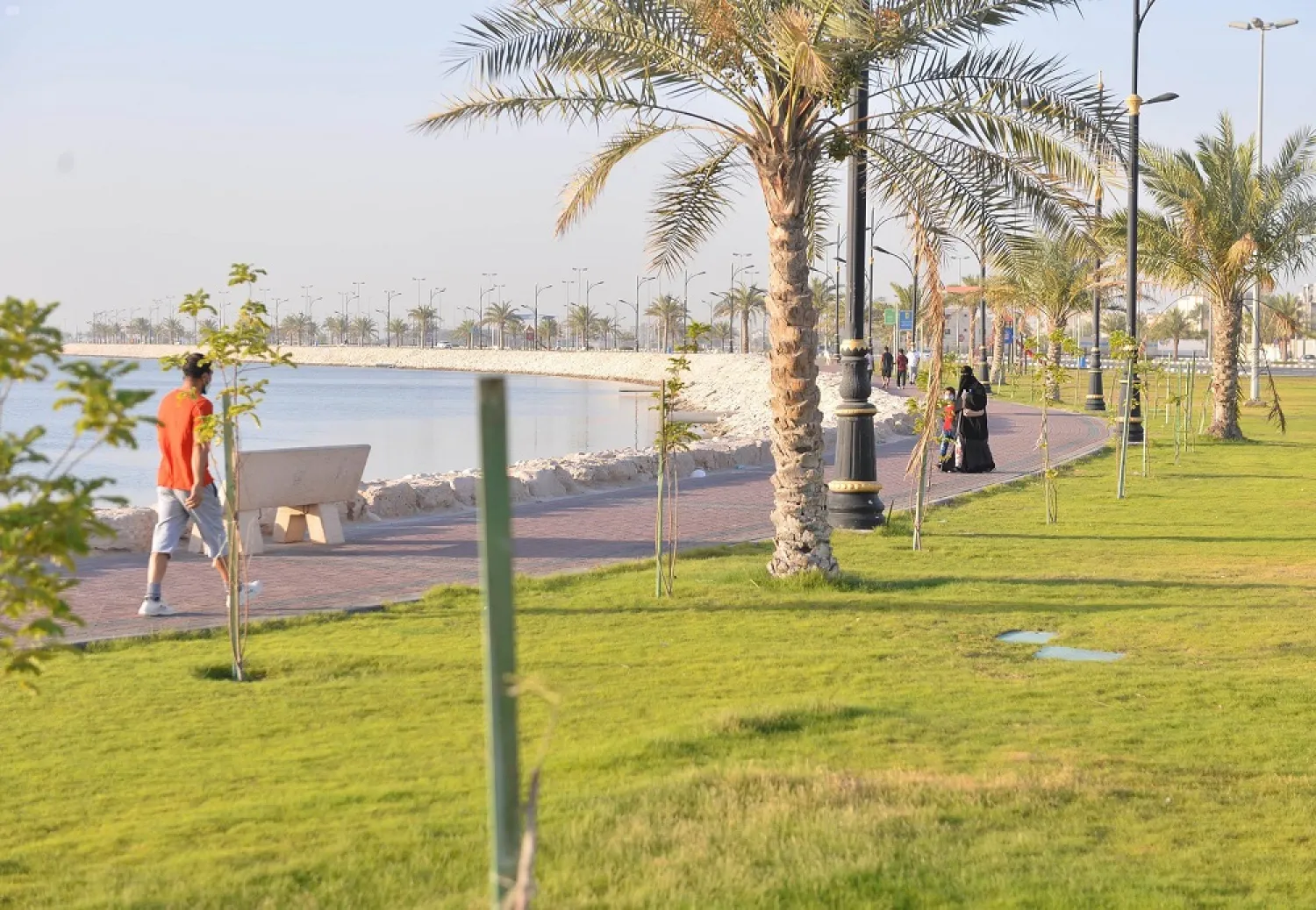 People seen at a waterfront walk in al-Qatif, Saudi Arabia. (SPA)