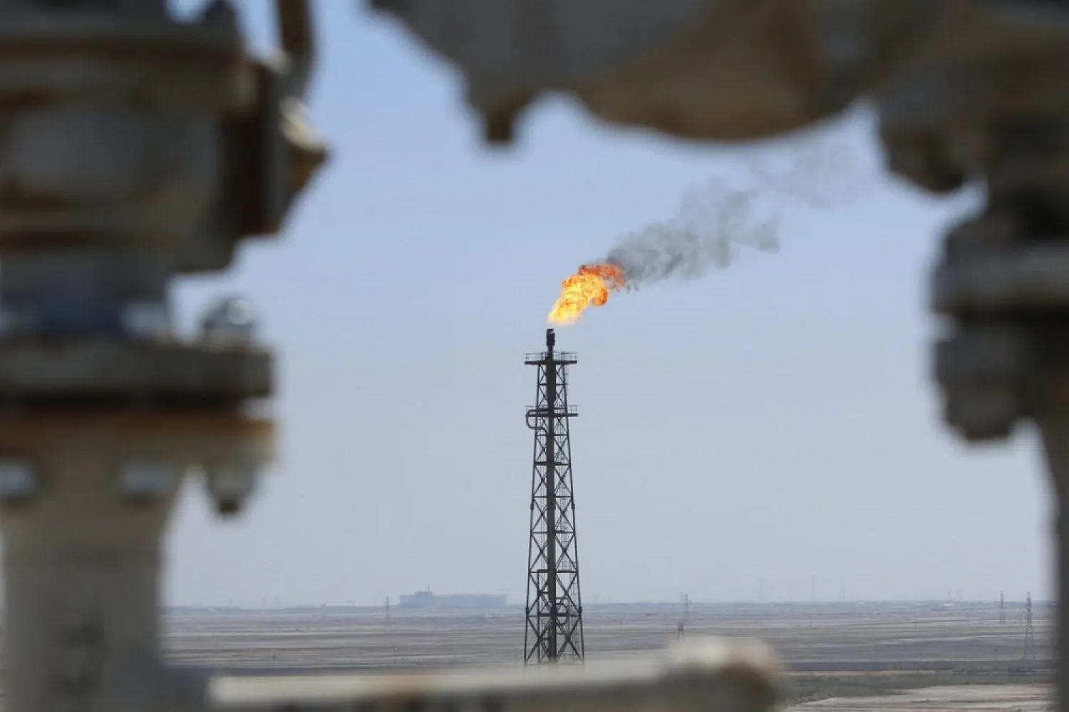 Gas burns off at the al-Shuaiba oil refinery in southwest Basra, Iraq. (Reuters)