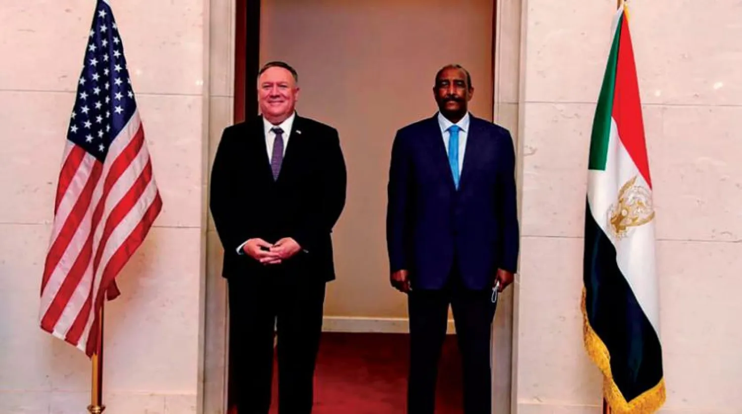 US Secretary of State Mike Pompeo with the head of the Sudanese Sovereign Council, Abdel Fattah al-Burhan, in Khartoum in October 2020 (AFP) 