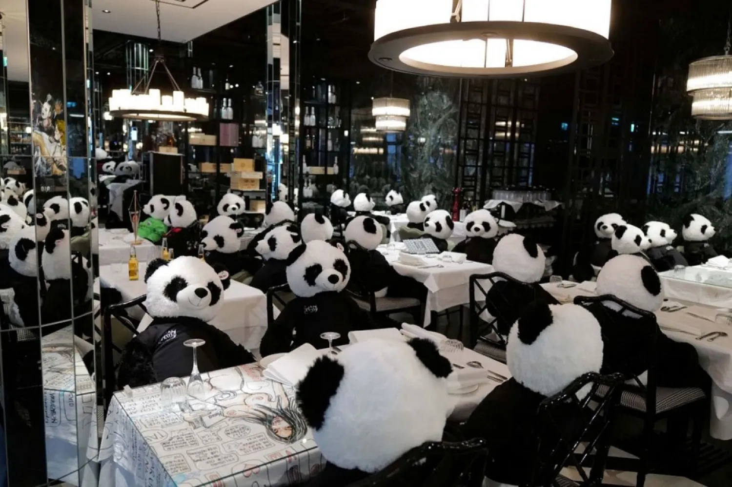 Toy panda bears as part of the art installation ‘Panda mie’ are seen at a restaurant to raise awareness of the Covid-19 lockdown's business impact on gastronomy in Frankfurt, Germany, Nov. 24, 2020. (Reuters)