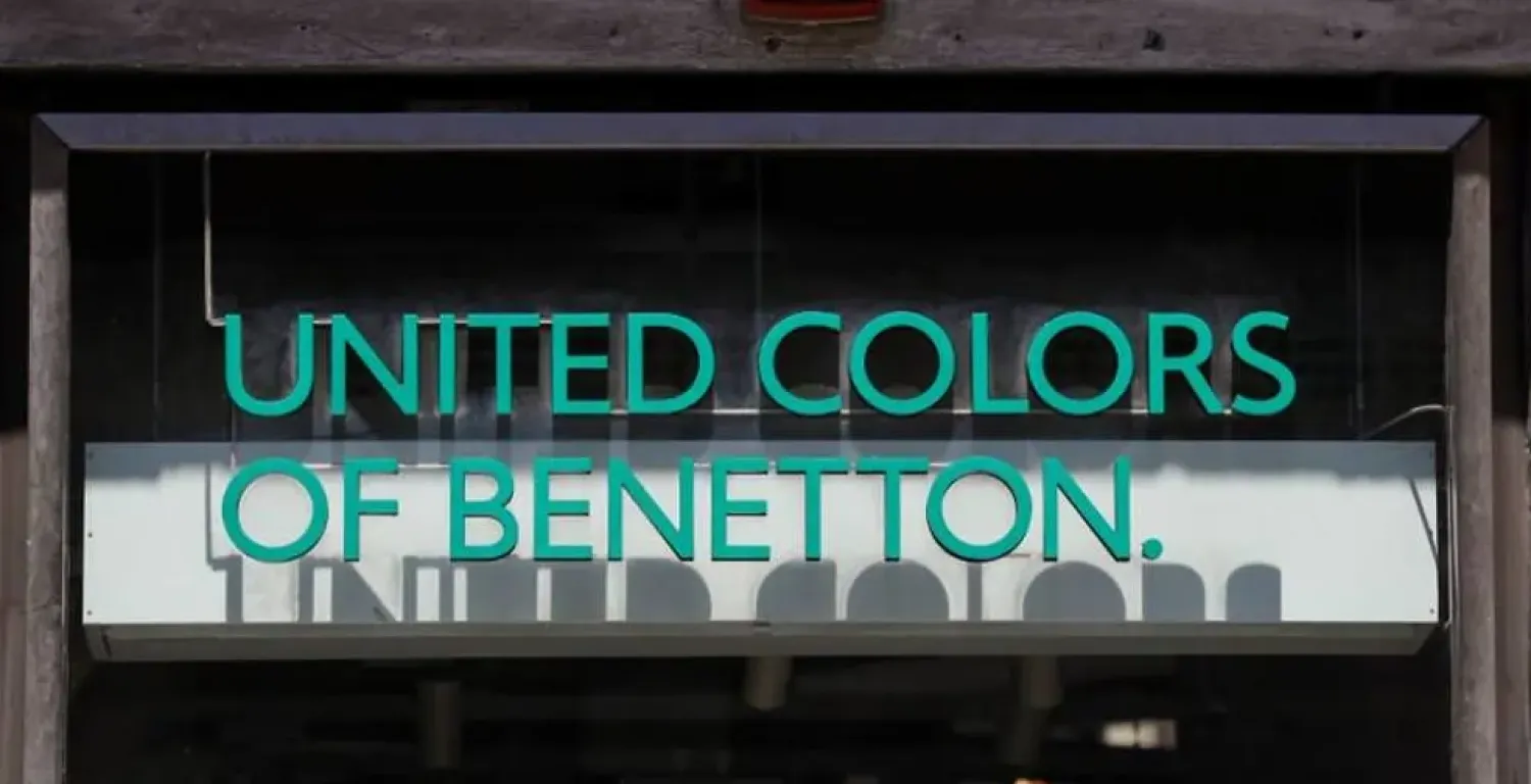 FILE PHOTO: A logo of United Colors of Benetton is seen in front of a store in Rome, Italy, July 21, 2020. REUTERS/Yara Nardi