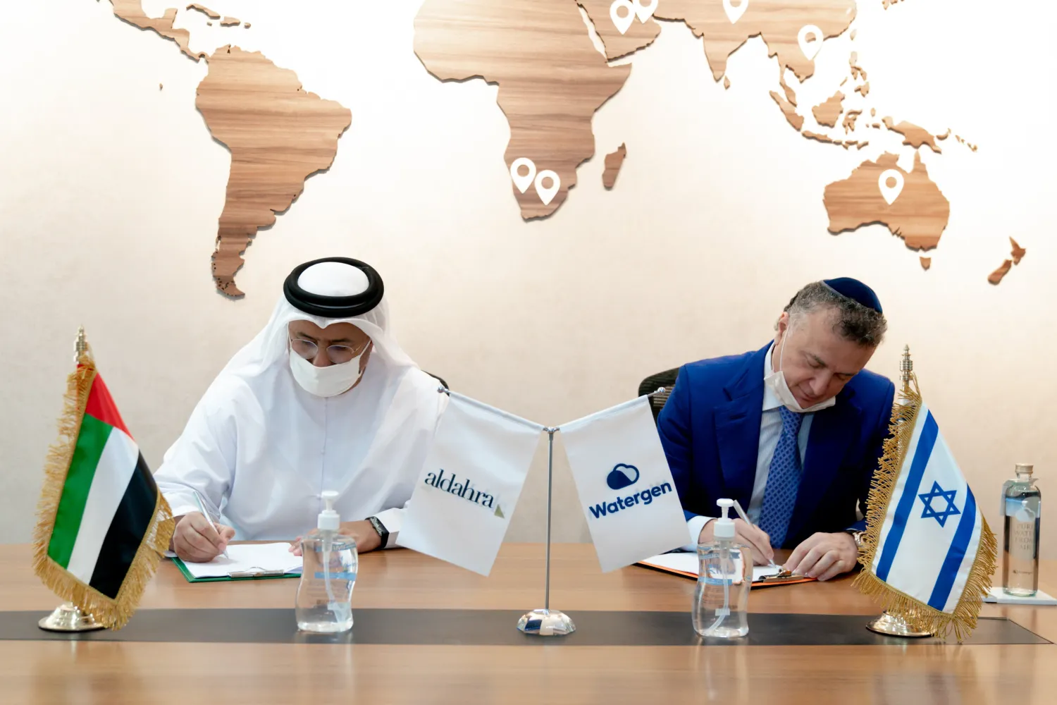 Khadim Al Darei, Vice-Chairman and Co-founder of Al Dahra Holding Company, and Michael Mirilashvili, CEO and President of Watergen signing UAE-Israeli water security deal. WAM
