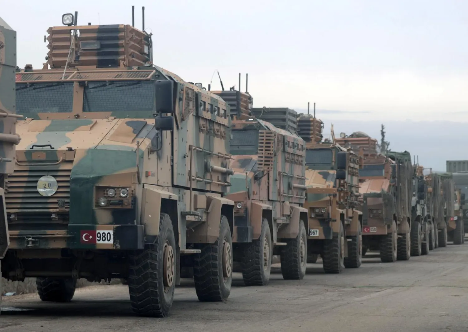 Turkish military vehicles are seen in Hazano near Idlib, Syria, February 11, 2020. REUTERS/Khalil Ashawi
