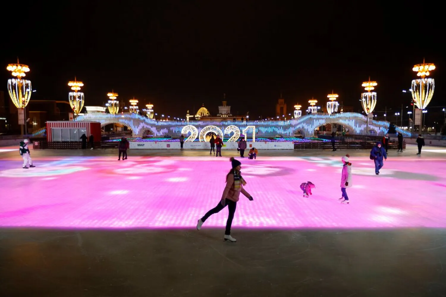 People skate during the opening of the rink at VDNKh amusement park in Moscow. (AP)
