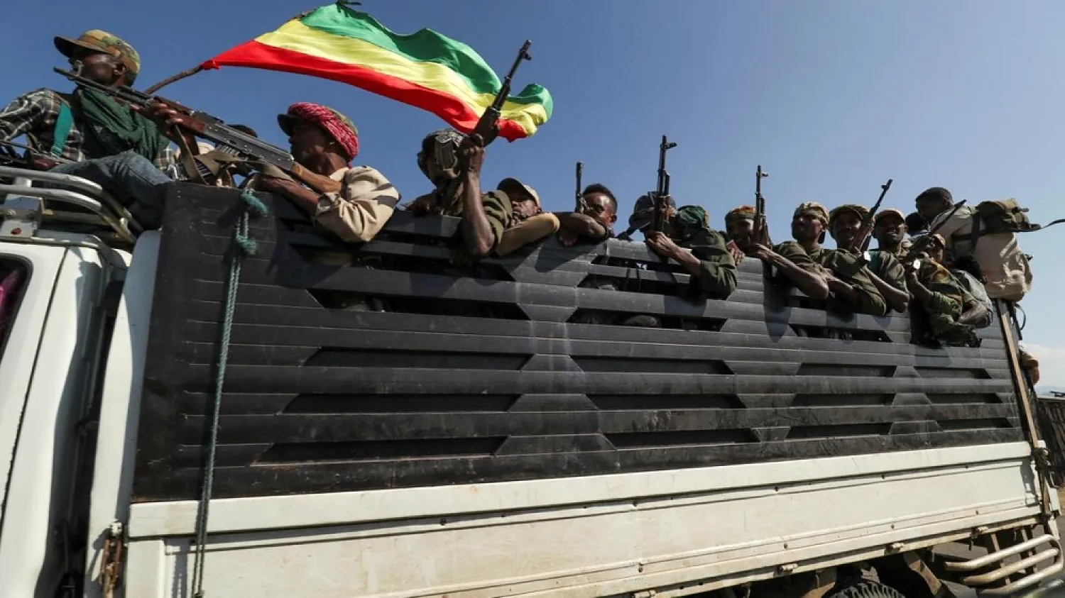Members of Amhara region militias ride on a truck as they head to face the Tigray People's Liberation Front (TPLF), in Sanja, Amhara, Ethiopia. (Reuters)