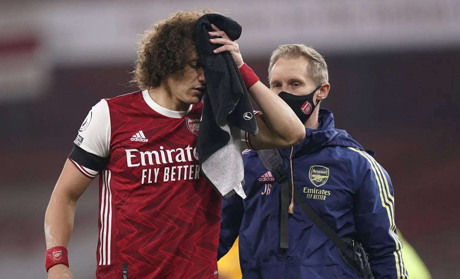 Arsenal's David Luiz holds a towel on a cut to his head following a clash with Wolverhampton Wanderers' Raul Jimenez during the Premier League match at Emirates Stadium, Nov. 29, 2020. (AP)