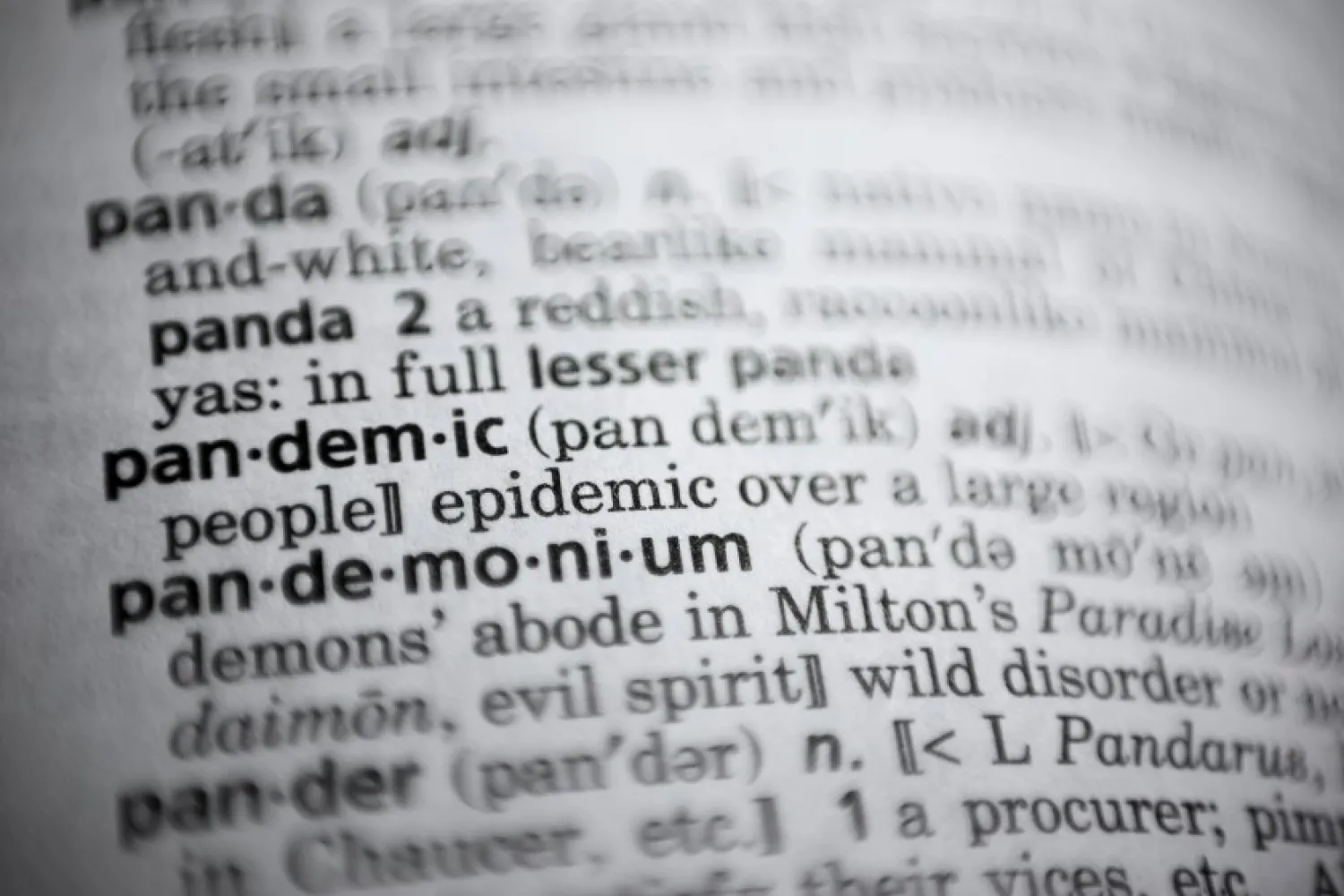 In this Saturday, Nov. 21, 2020, photo the word pandemic is displayed in a dictionary in Washington. Merriam-Webster on Monday announced "pandemic" as its 2020 word of the year. (AP Photo/Jenny Kane)