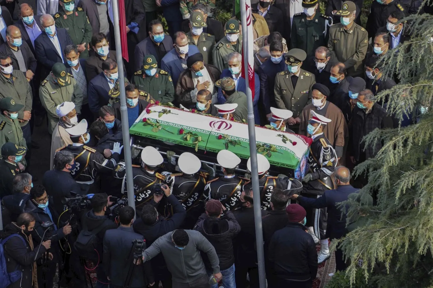 In this photo released by the official website of the Iranian Defense Ministry, military personnel carry the coffin of Mohsen Fakhrizadeh in a funeral ceremony in Tehran, Iran, Monday, Nov. 30, 2020. (AP)