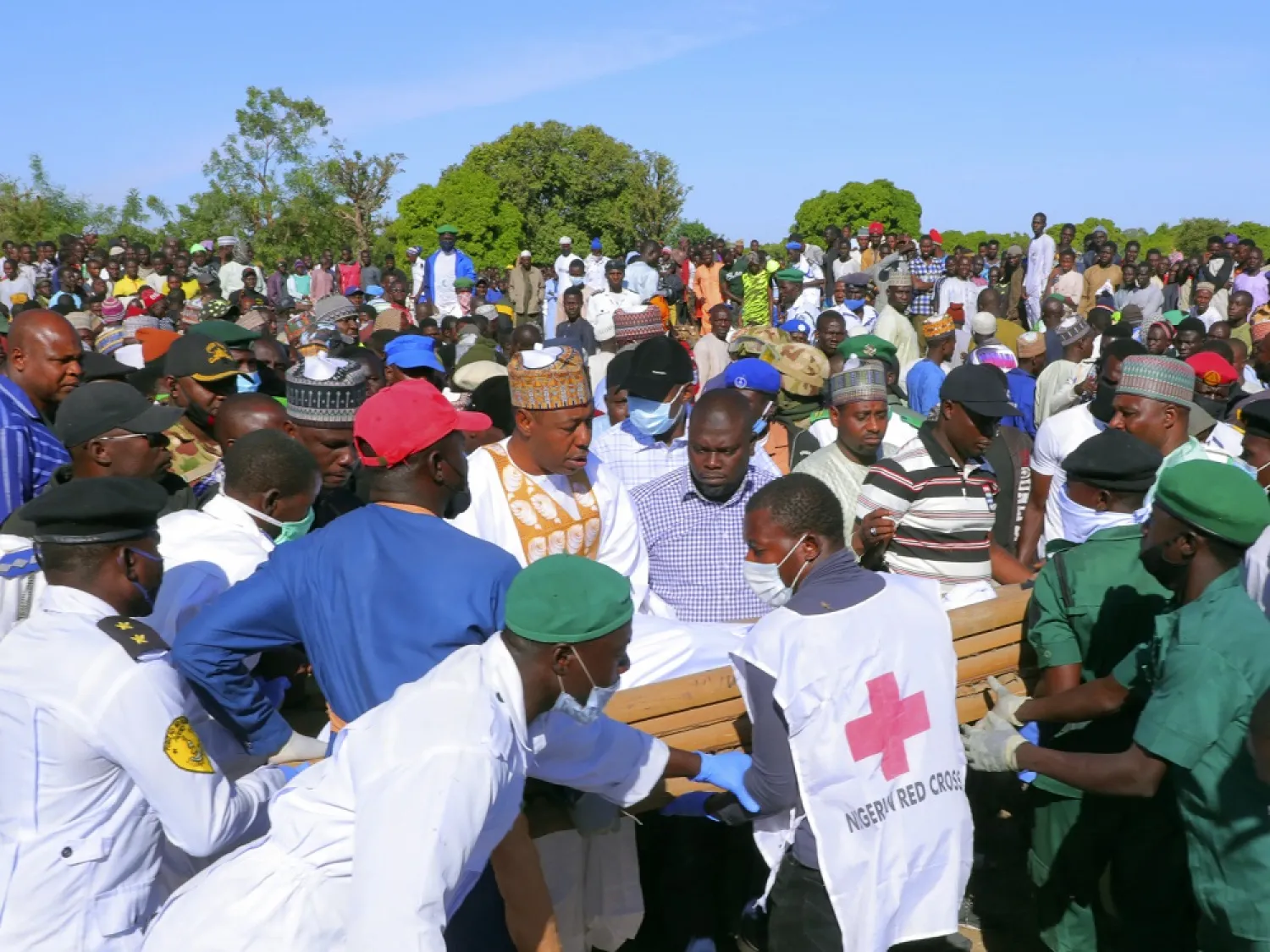 People attend a funeral for those killed by suspected Boko Haram militants in Zabarmari, Nigeria on Sunday. (AP)