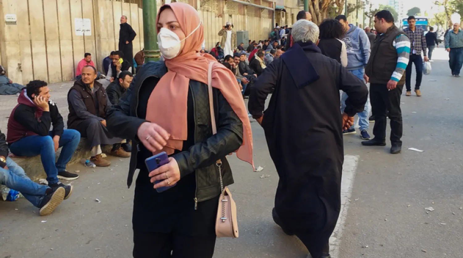 Egyptians gather in front of the Central Public Health Laboratories in downtown Cairo as they wait to get tested for the coronavirus (COVID-19) on March 8, 2020. (AFP)
