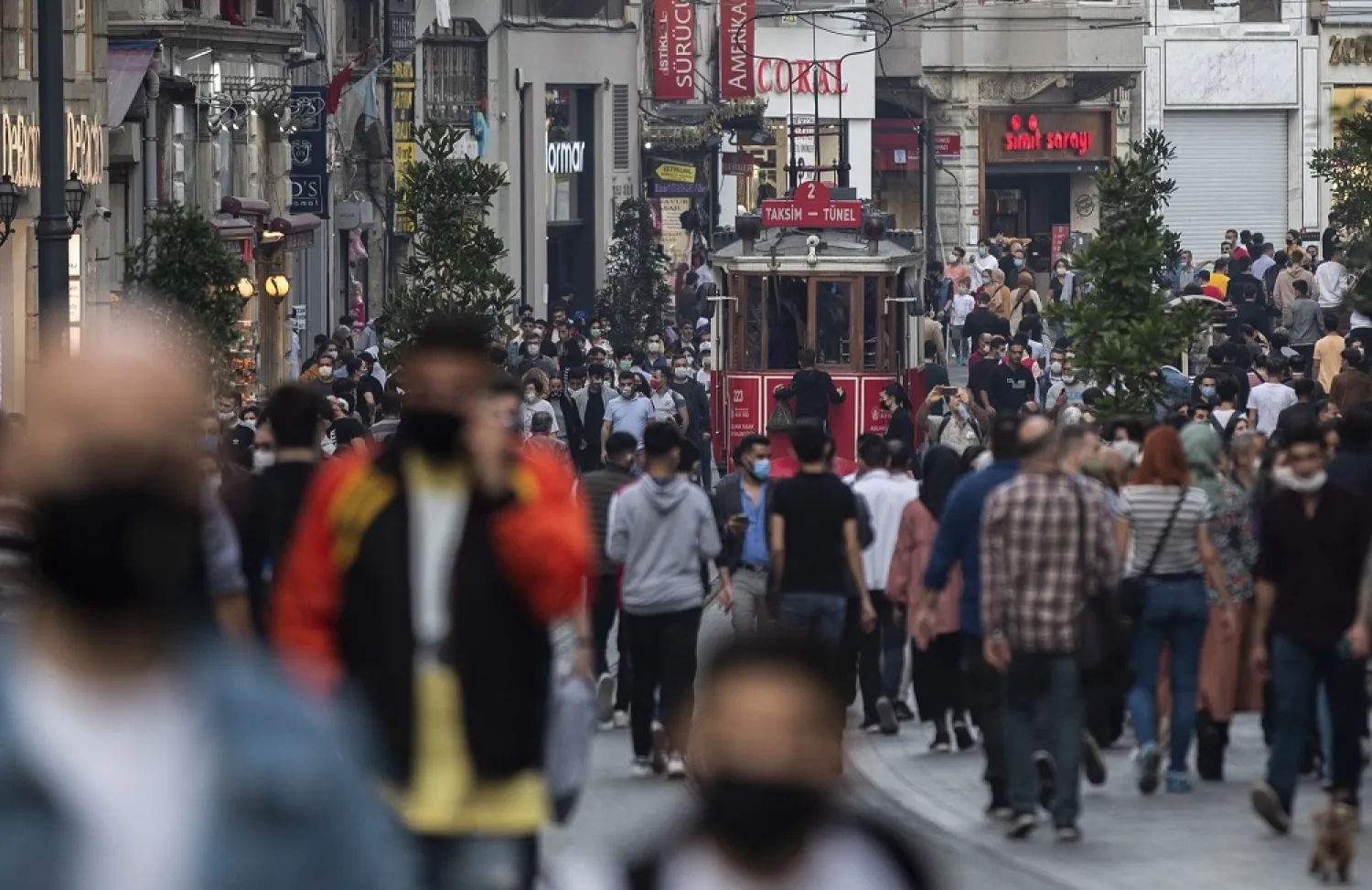 People wearing protective masks walk on Istiklal Street amid the ongoing coronavirus pandemic in Istanbul, Turkey, Oct. 25, 2020. (EPA)