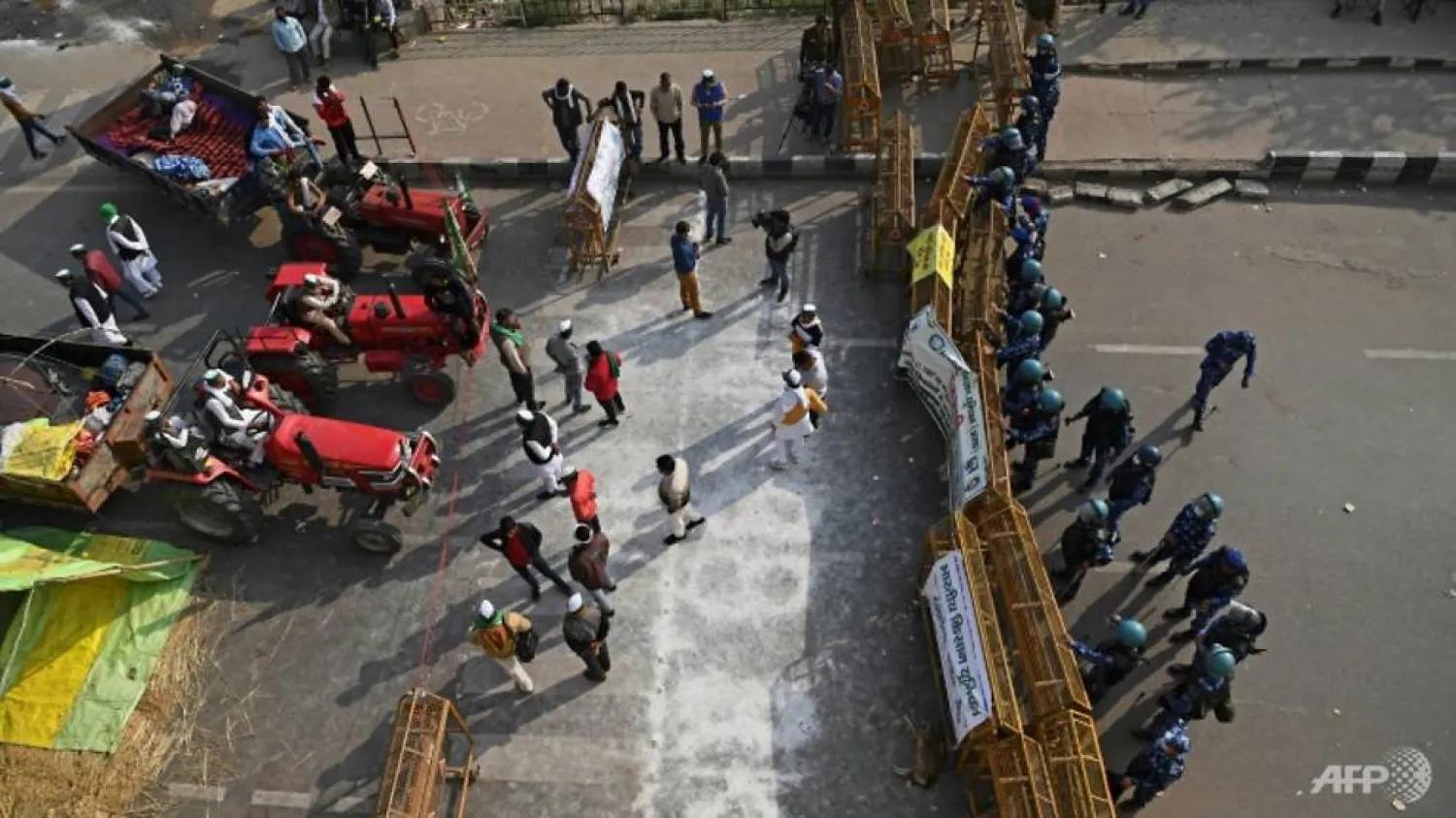 The plight of farmers is a major political issue in India with thousands committing suicide in recent years due to debt and increasingly erratic weather patterns blamed on climate change | AFP