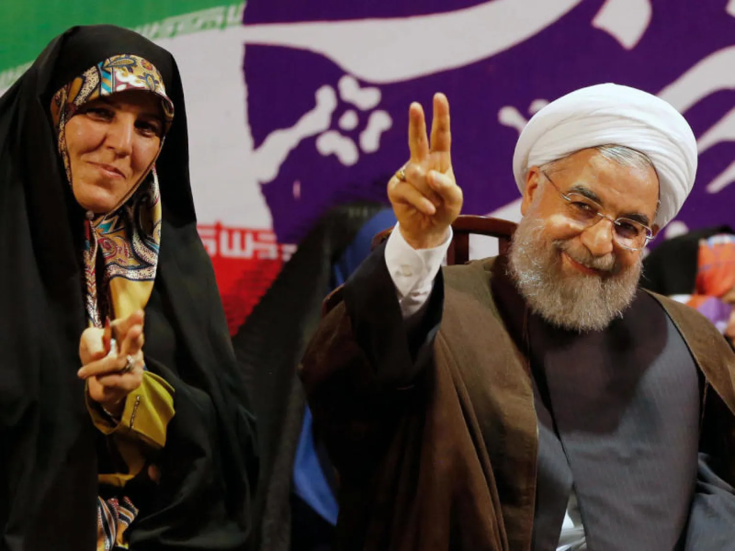 الرئيس الإيراني حسن روحاني وإلى جانبه نائبته السابقة شهيندخت مولاوردي (أرشيفية - أ.ف.ب)
