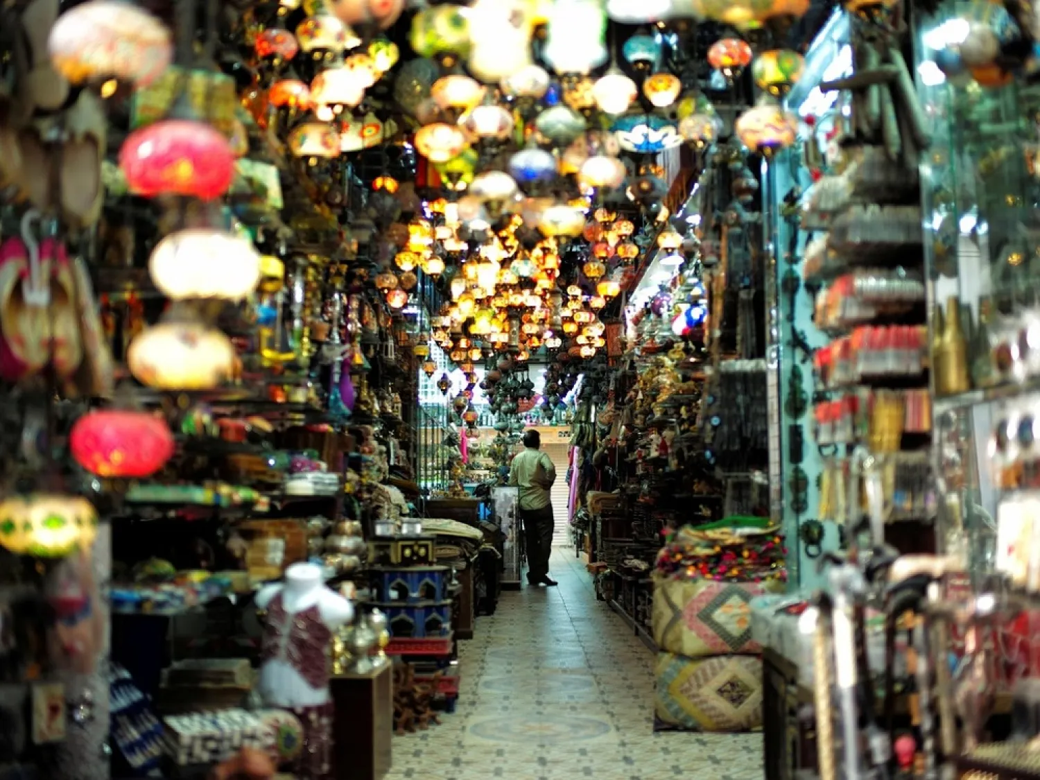 A visitor looks at traditional light-shop in Bab al Bahrain souq in Manama. (Reuters)