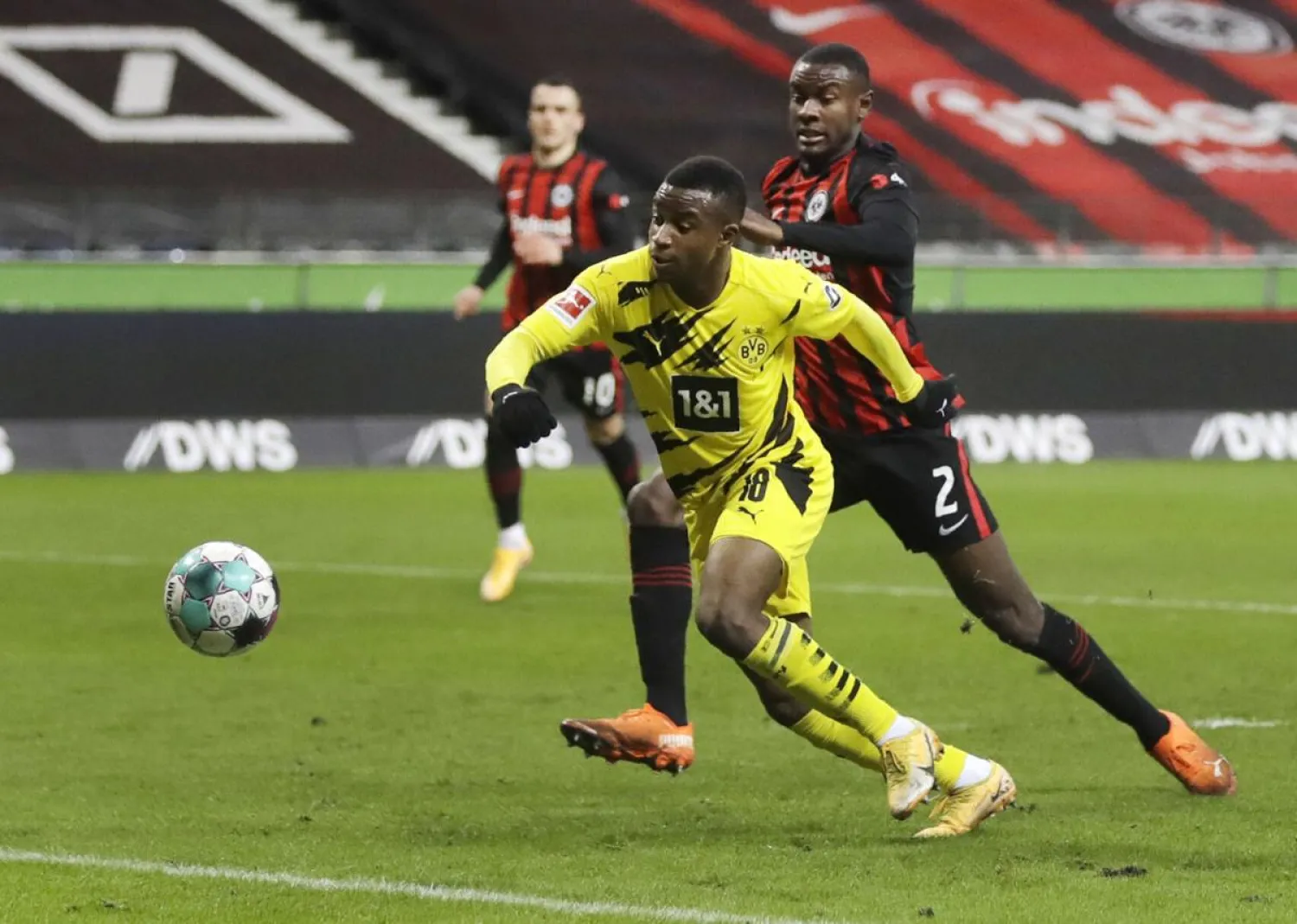 Frankfurt's Evan N'Dicka, right, and Dortmund's Youssoufa Moukoko challenge for the ball during the match in Frankfurt, Germany, Dec. 5, 2020. (AP)