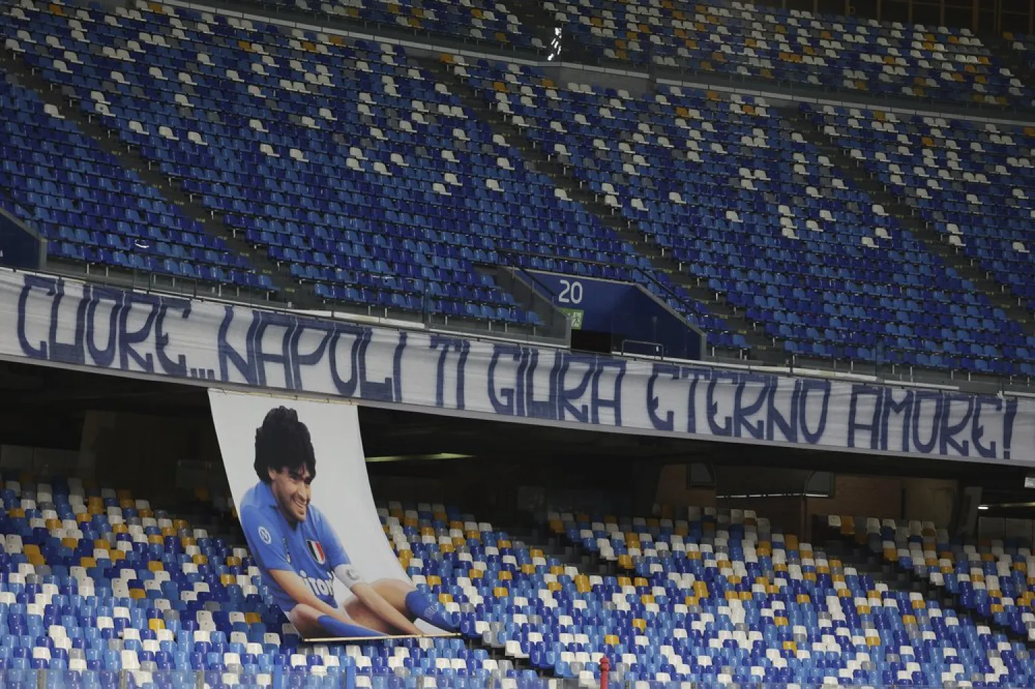 A banner reading in Italian "Heart...Naples swears to you eternal love" to honor Diego Maradona is displayed in the stands prior to the Serie A match between Napoli and Roma, at the Naples San Paolo Stadium, Nov. 29, 2020. (AP)