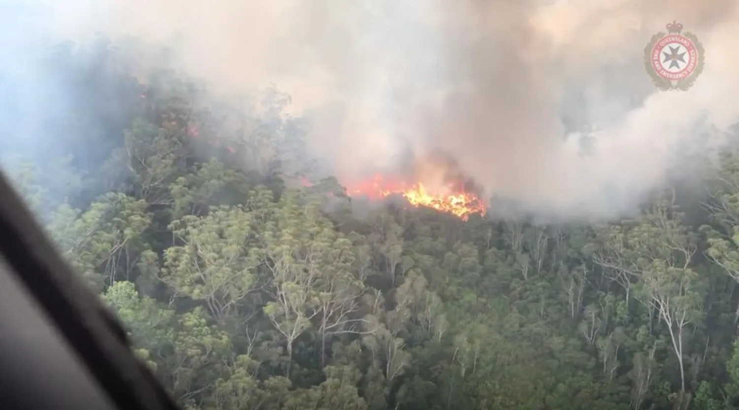FILE PHOTO: An aerial view shows bushfires on Fraser Island, Queensland, Australia, in this still image taken from video released on December 2, 2020. Queensland Fire and Emergency Services/via REUTERS
