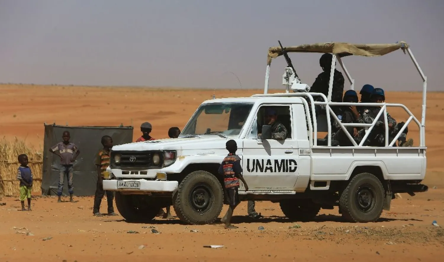 Members of the UN-African Union mission in Darfur (UNAMID) drive inside the Zam Zam camp in North Darfur (File photo: AFP)
