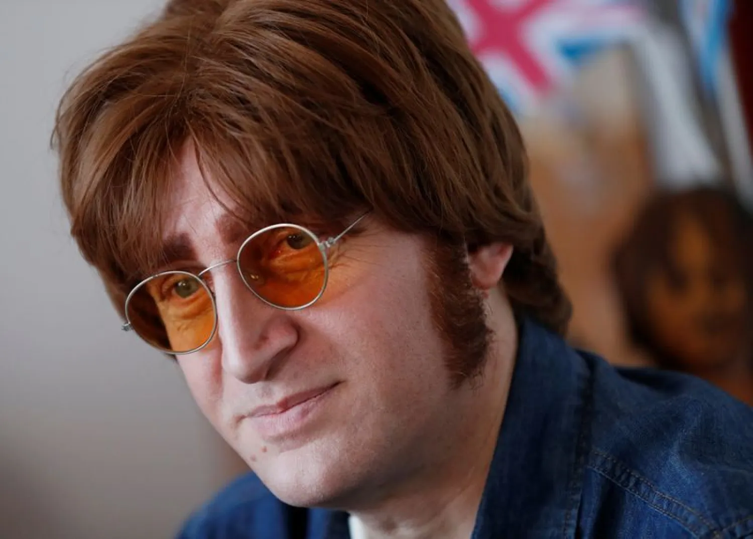Javier Parisi, who impersonates late former Beatle John Lennon, looks on during an interview with Reuters, in Lanus, on the outskirts of Buenos Aires, Argentina November 18, 2020. (Reuters)