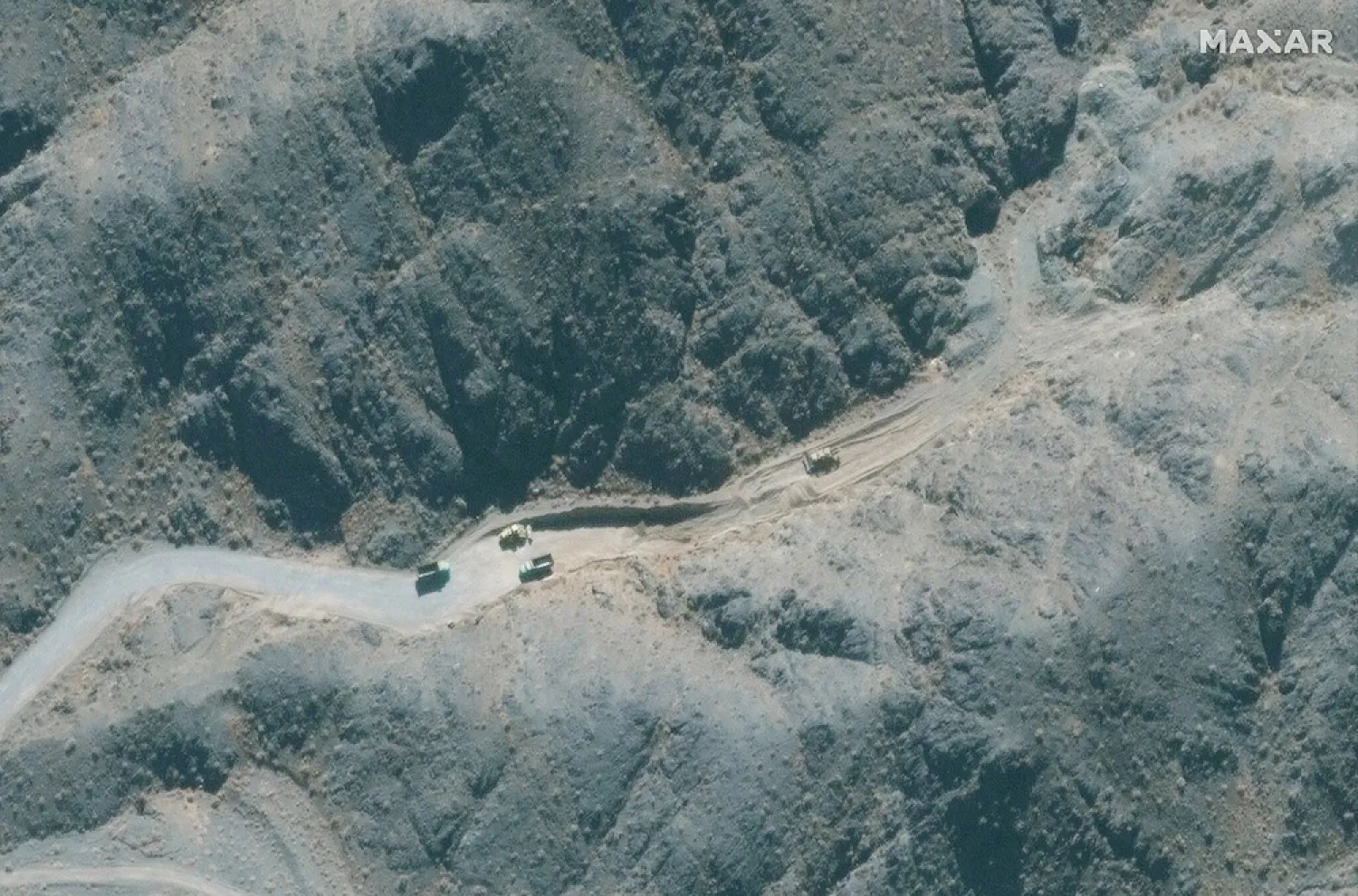 Road work and earth-moving vehicles outside a future tunnel entrance. Oct. 21, 2020. (Maxar Technologies)