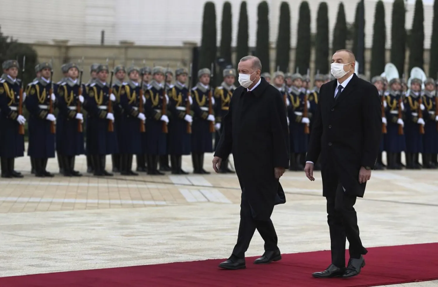 Turkey's President Erdogan, center, and Azerbaijan's President Aliyev, right, review a honor guard during a welcome ceremony in Baku, Azerbaijan, Dec. 10, 2020. (AP)