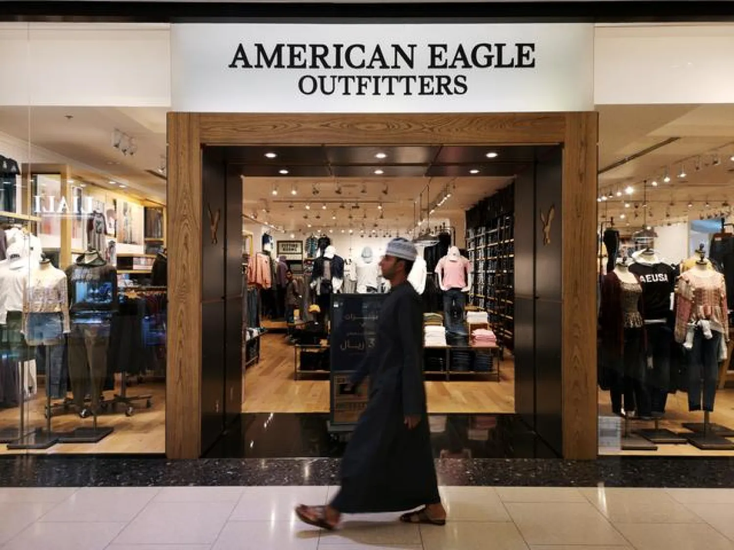 A Omani man passes in front of an American fashion brand, American Eagle Outfitters in City Center Mall in Muscat, Oman, on February 11, 2019. REUTERS/Hamad I Mohammed
