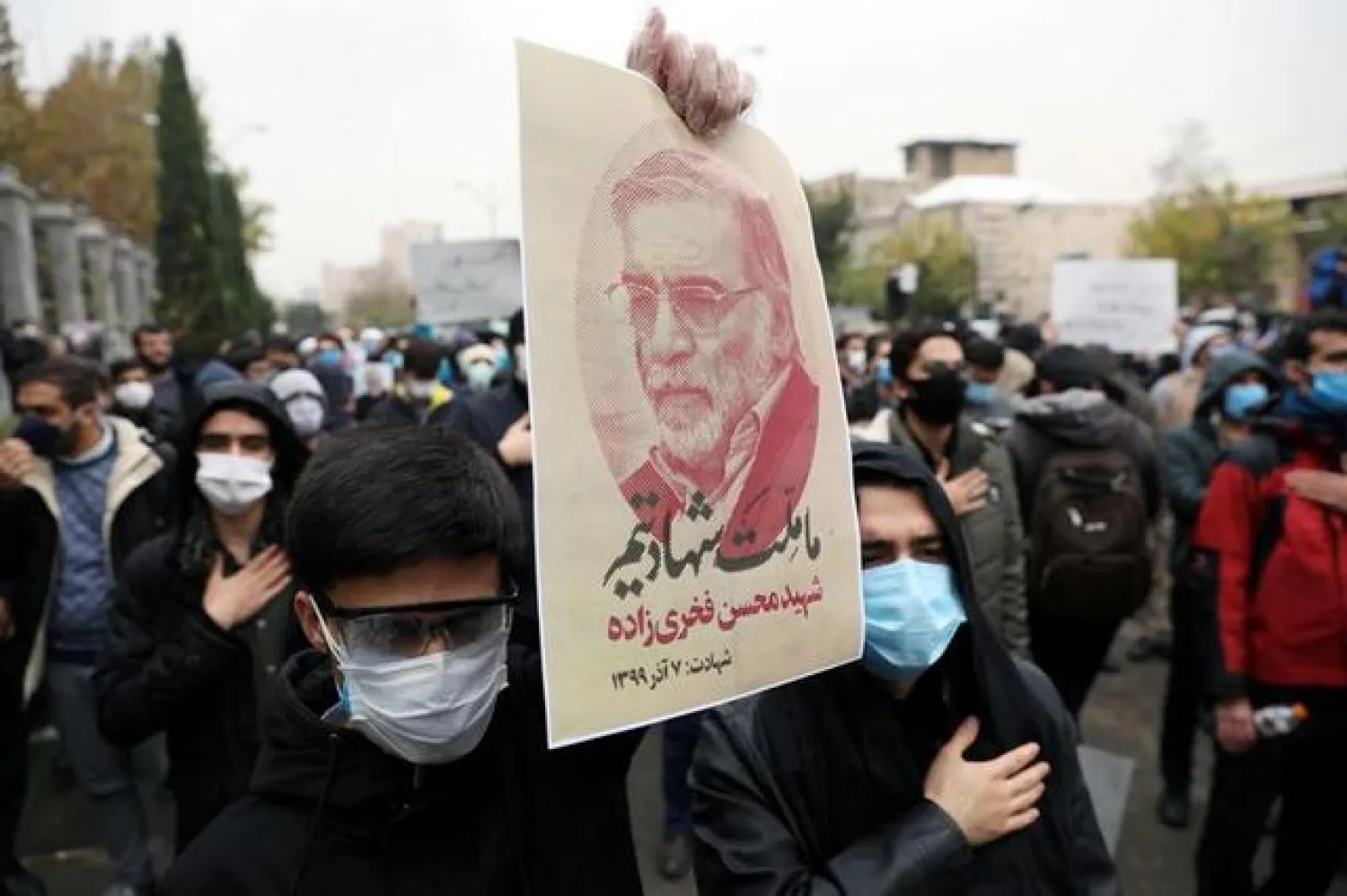 A protester holds a picture of Mohsen Fakhrizadeh, Iran's top nuclear scientist, during a demonstration against his killing in Tehran (File photo: Reuters)