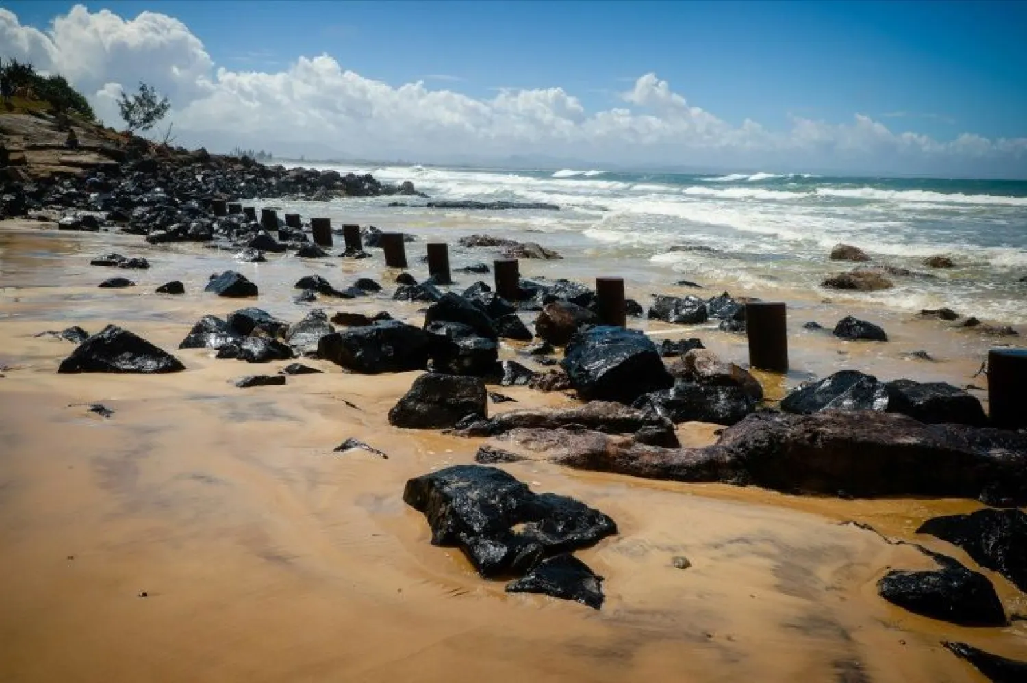 Australia's Byron Bay main beach has lost much of its sand after wild weather lashed New South Wales and Queensland with heavy rain, strong winds, and king tides | AFP