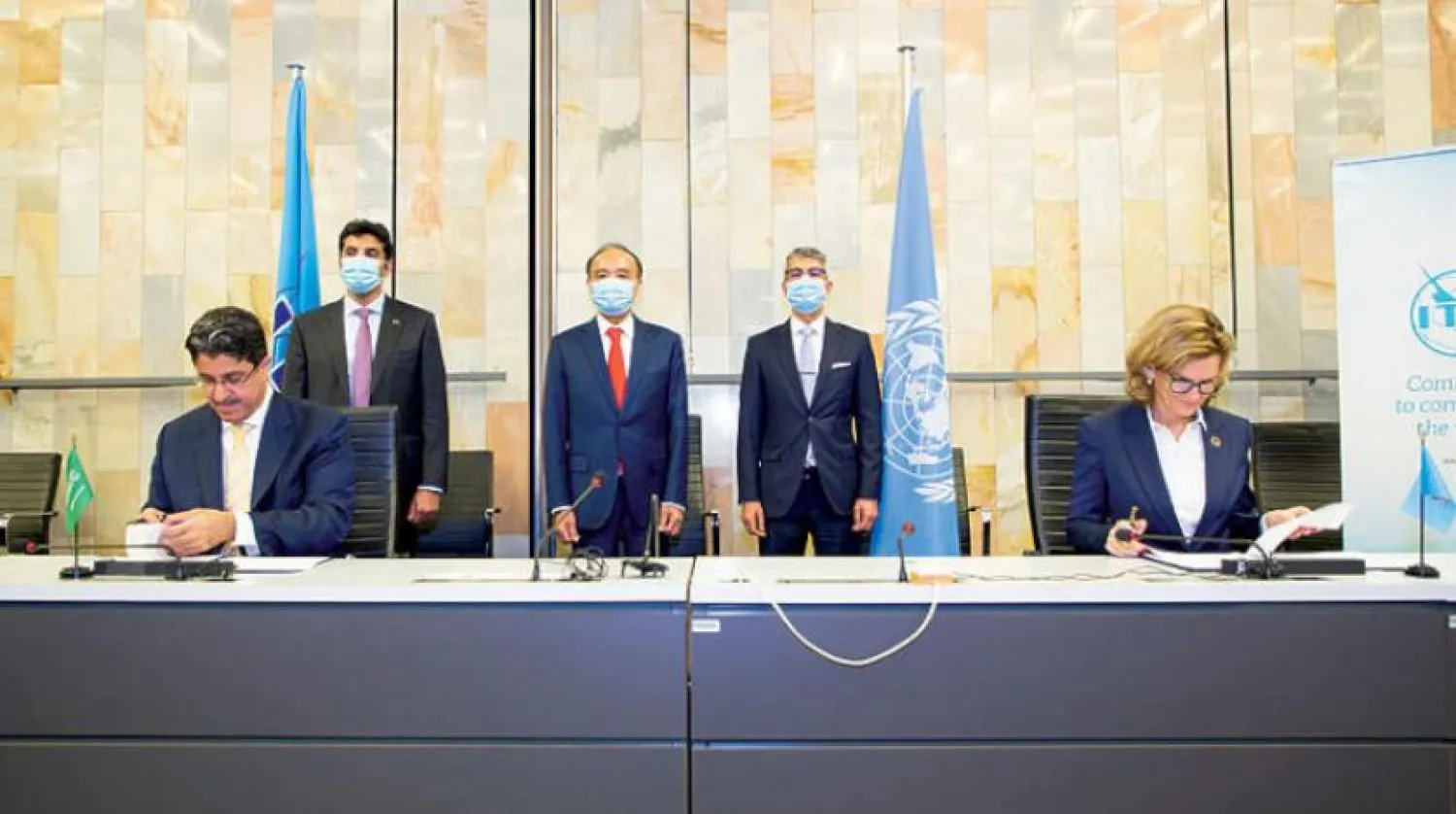 NCA Gov. Khalid bin Abdullah Al-Sabti  and ITU’s telecommunication development bureau director Doreen Bogdan-Martin signing the agreement in Geneva (Asharq Al-Awsat)
